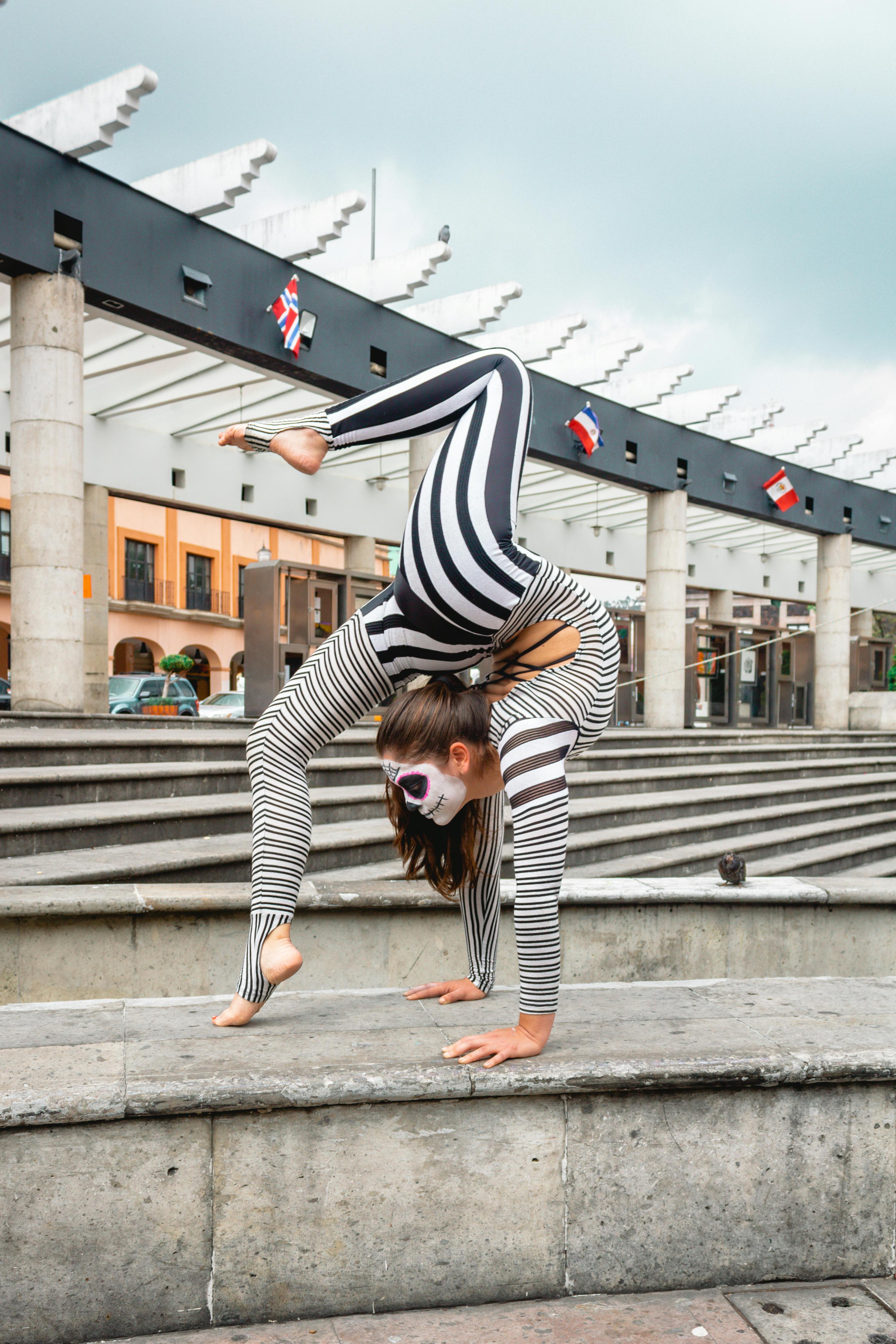 someone doing gymnastics with a camouflauge suit