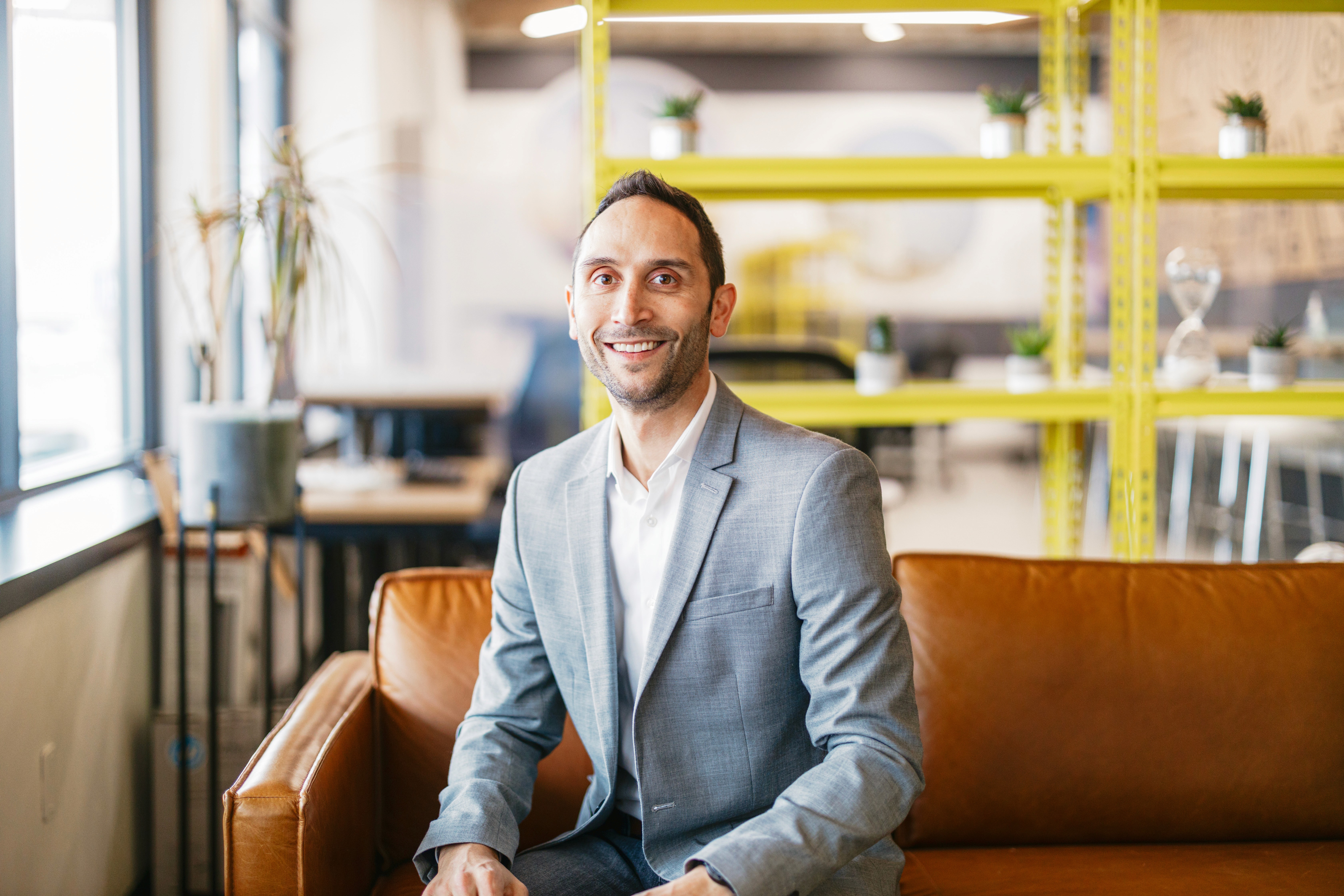 person sitting in a chair in front of a man