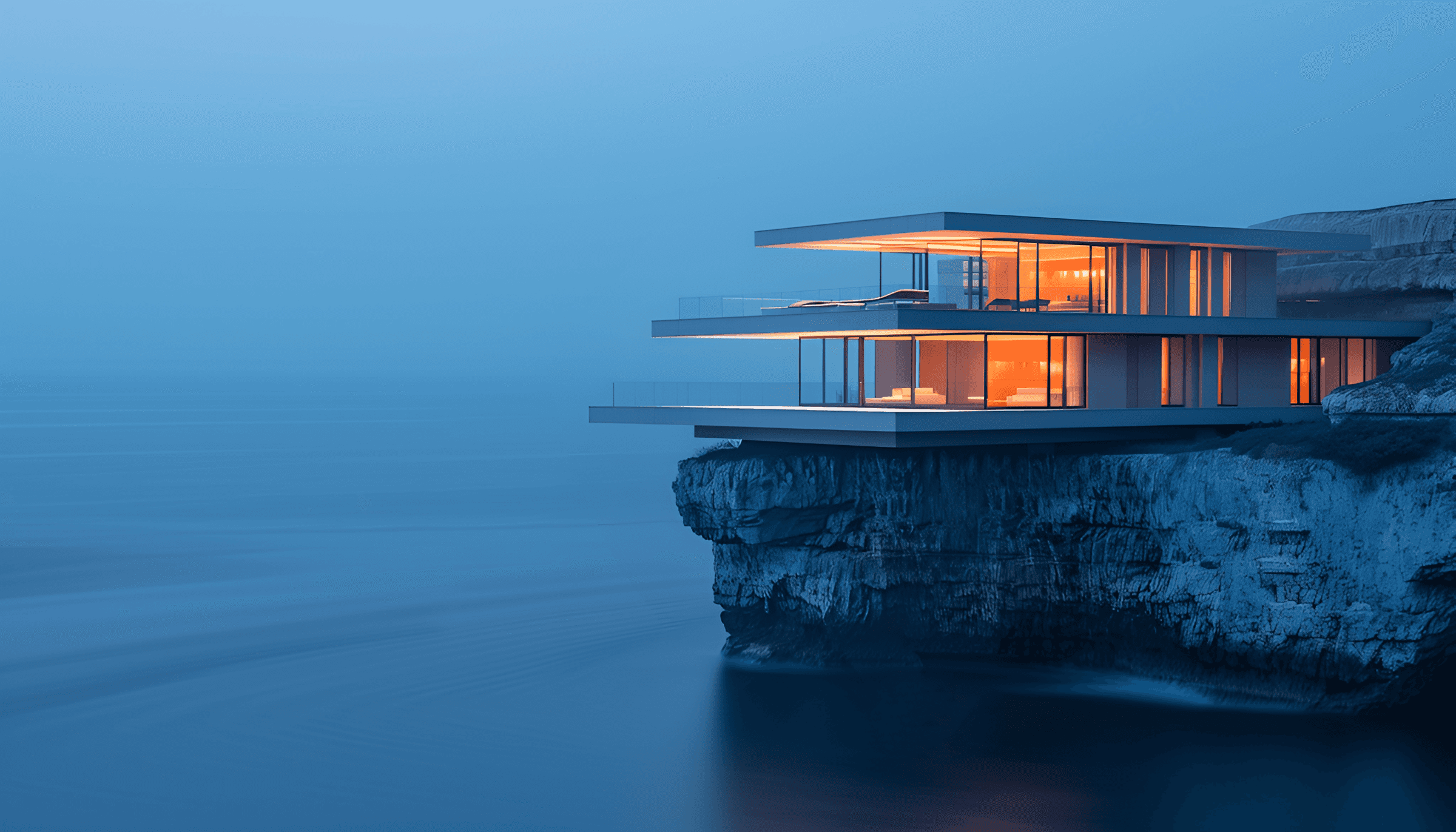 modern cliffside luxury home at dusk