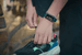 A budget and a premium fitness tracker side by side on a wrist
