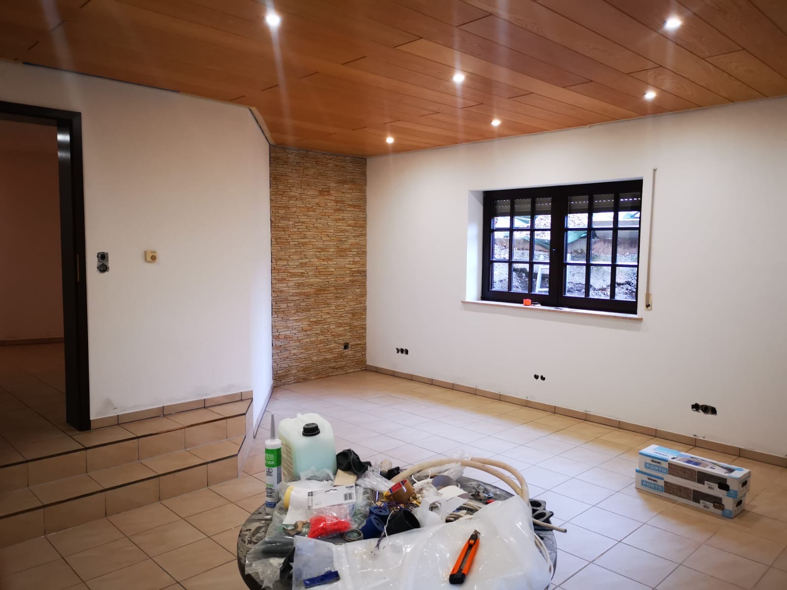 a white building with a black door