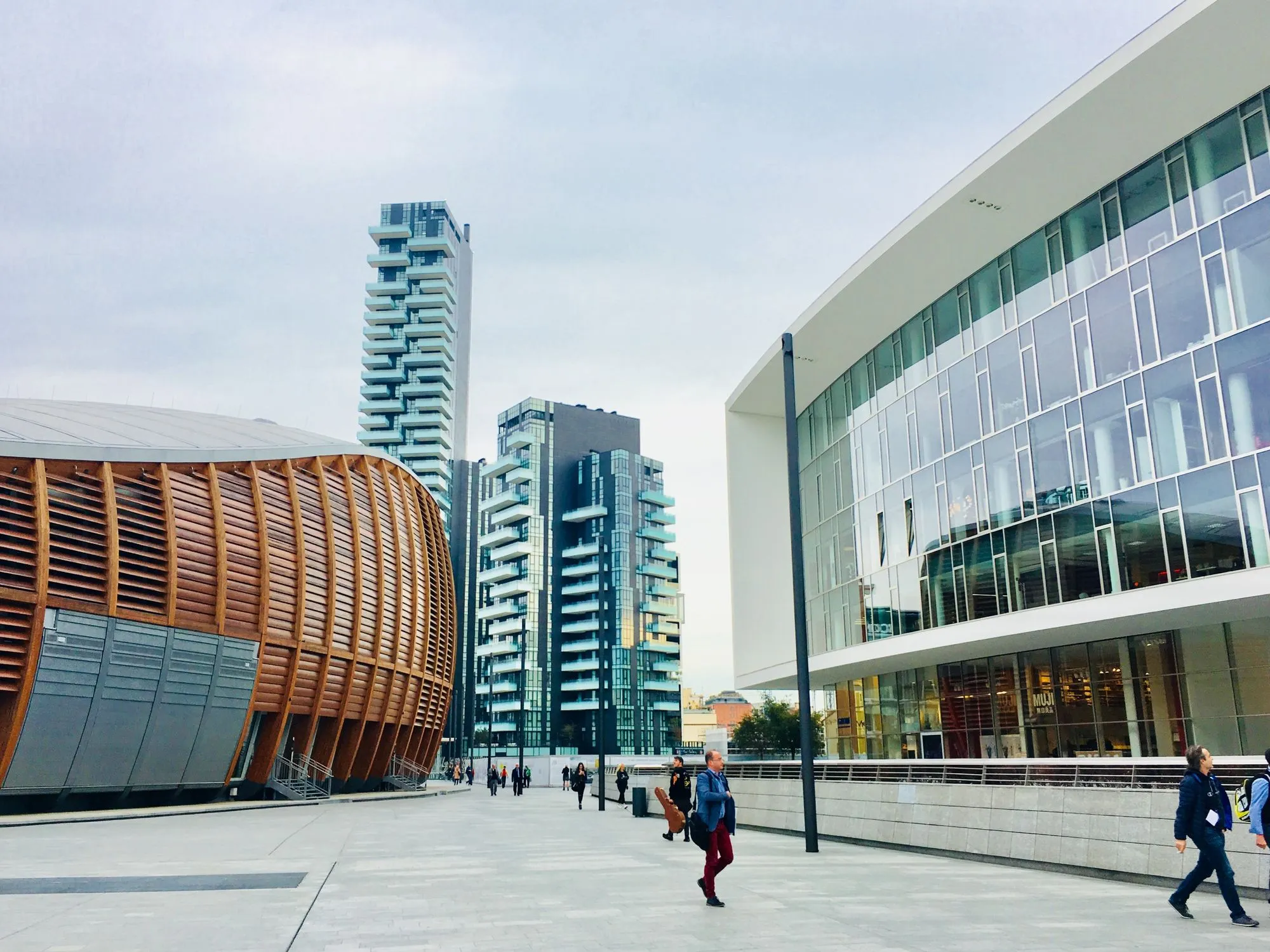 People walking in Piazza Gae Aulenti, Milan, Italy