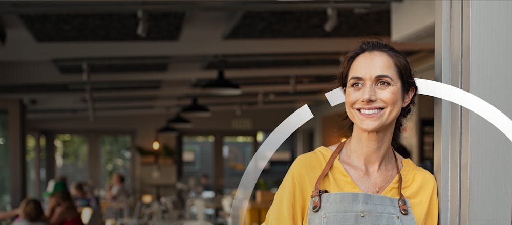 Confident small business owner in retail environment ready to streamline operations with premade Workflow templates