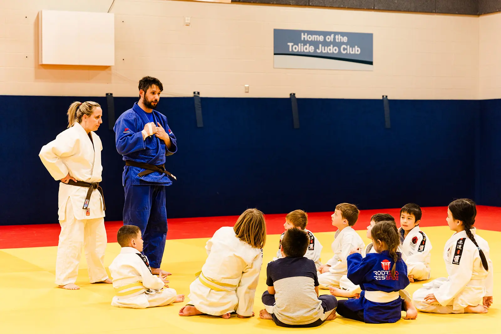 Sensei teaching kids judo class