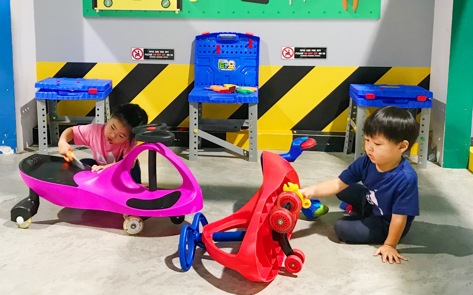 Children playing with toy cars at Tayo Station-8 indoor play area.
