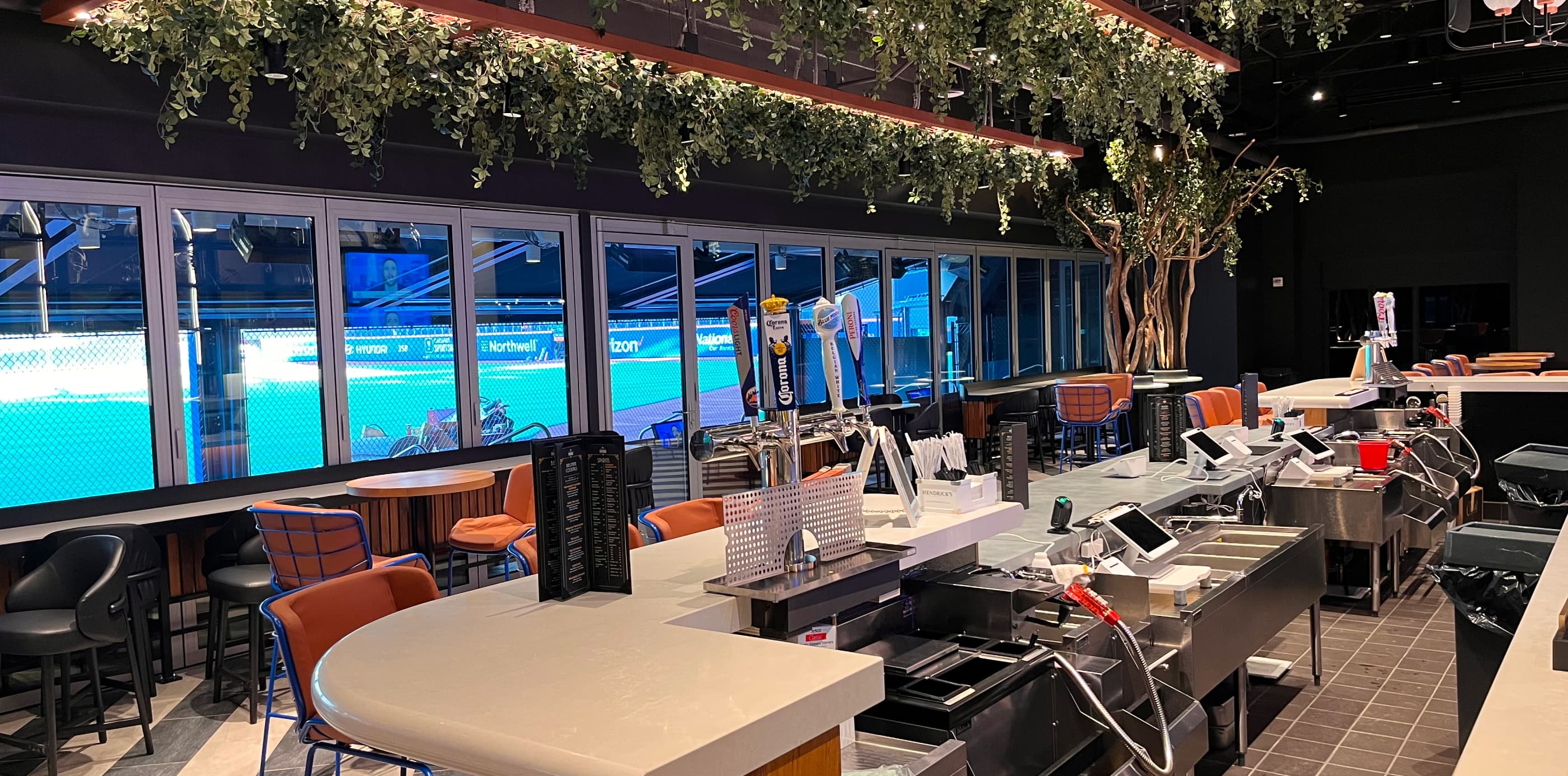 A modern bar with hanging plants