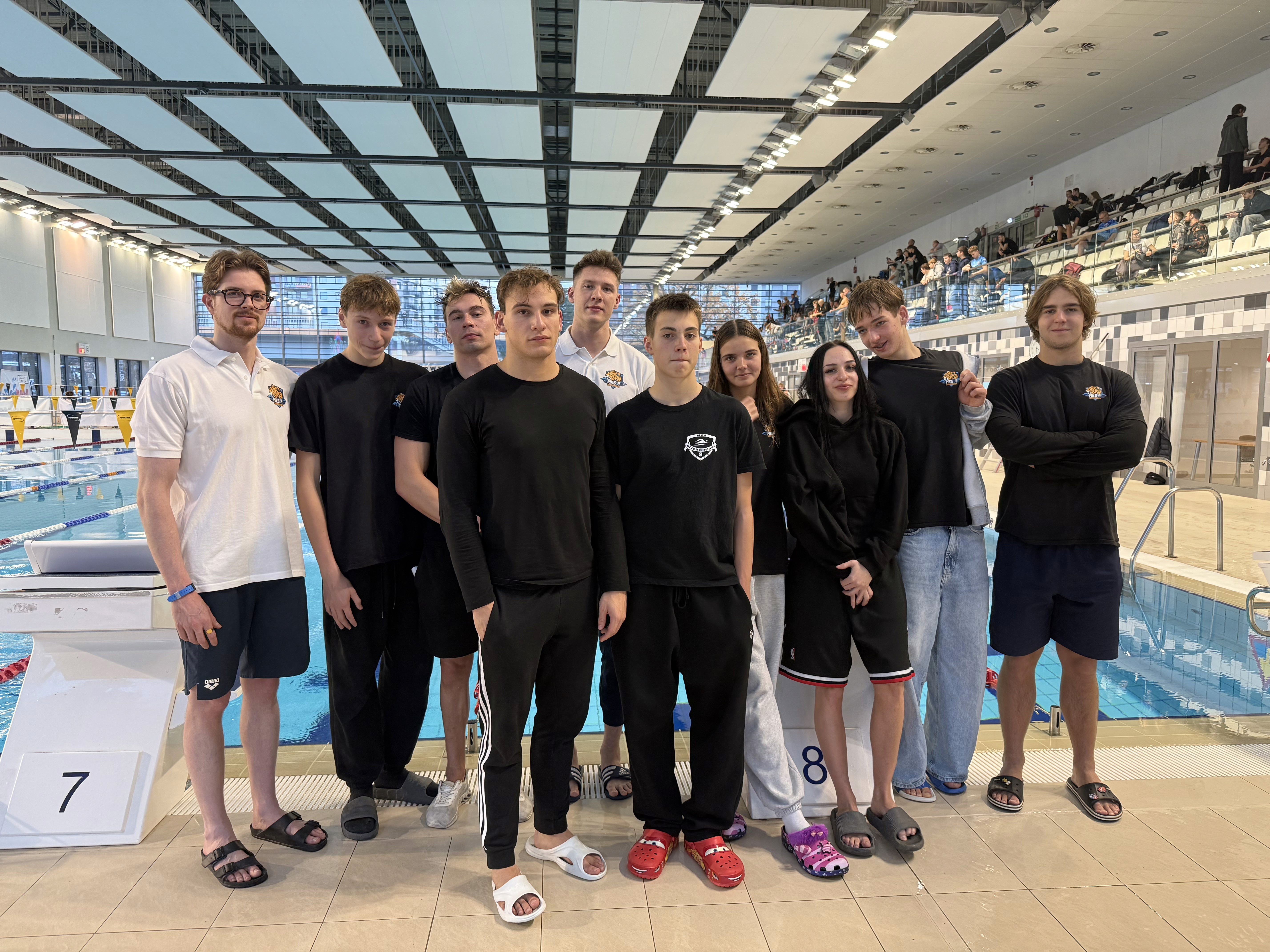 Group of men standing with Sufboard