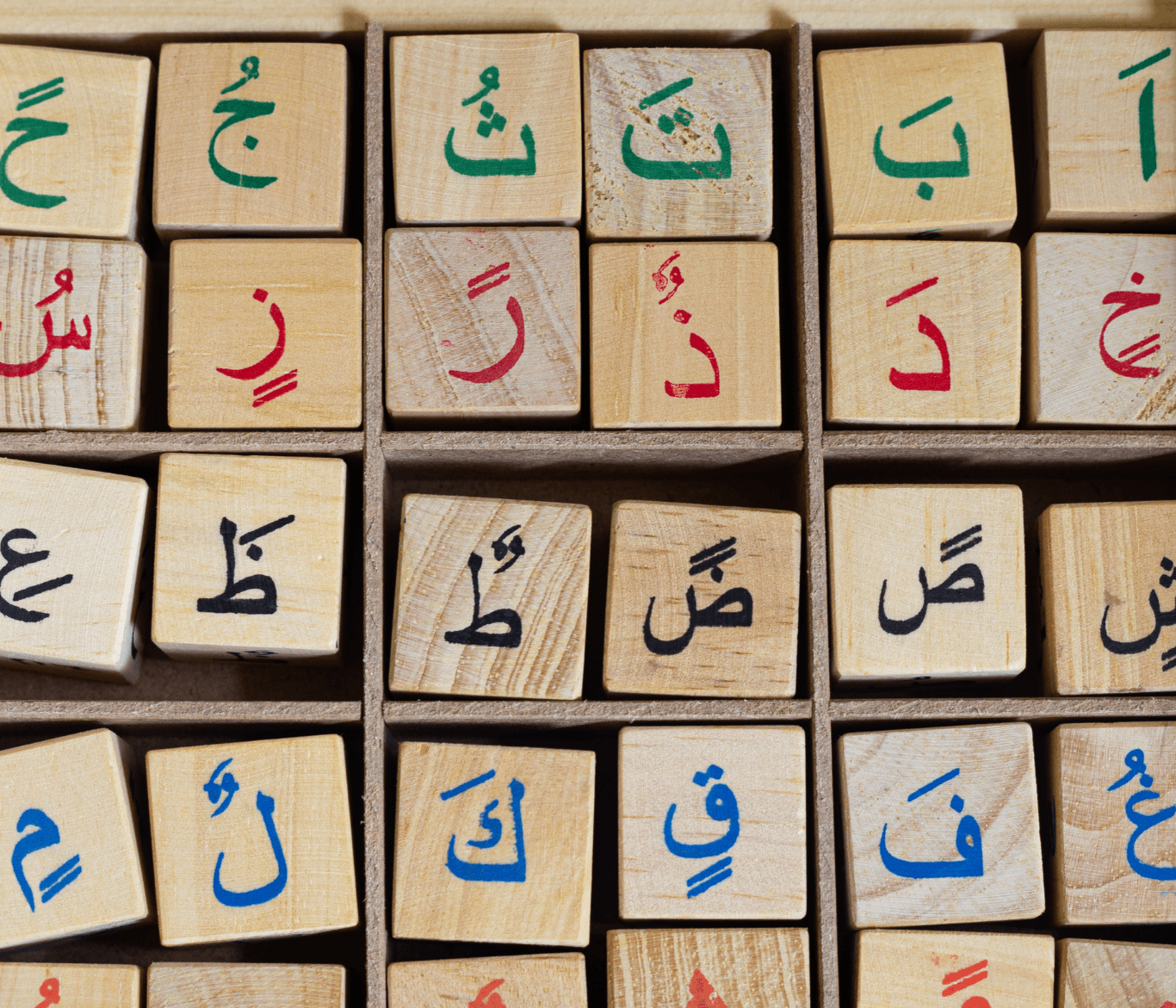 two women talking while looking at laptop computer