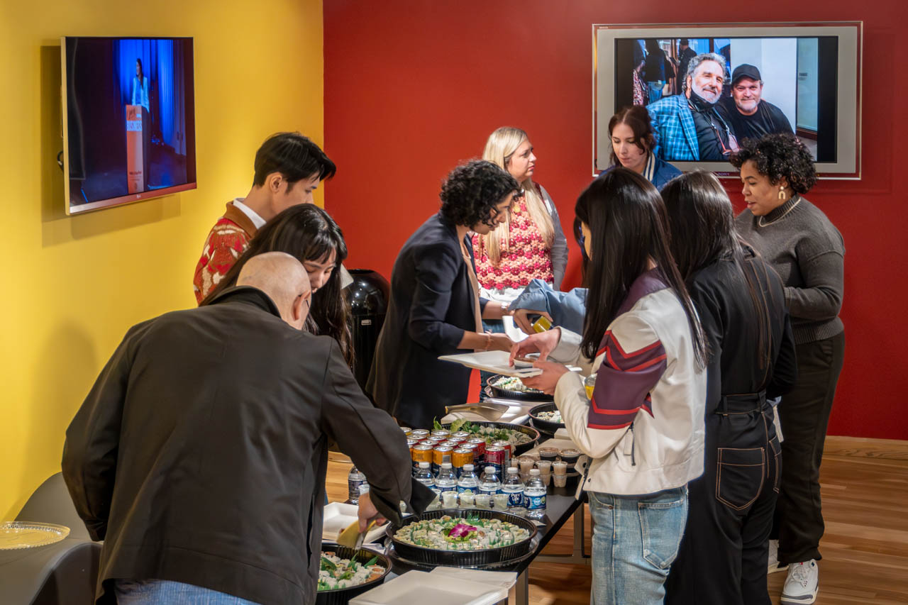 group of people eating at a buffet