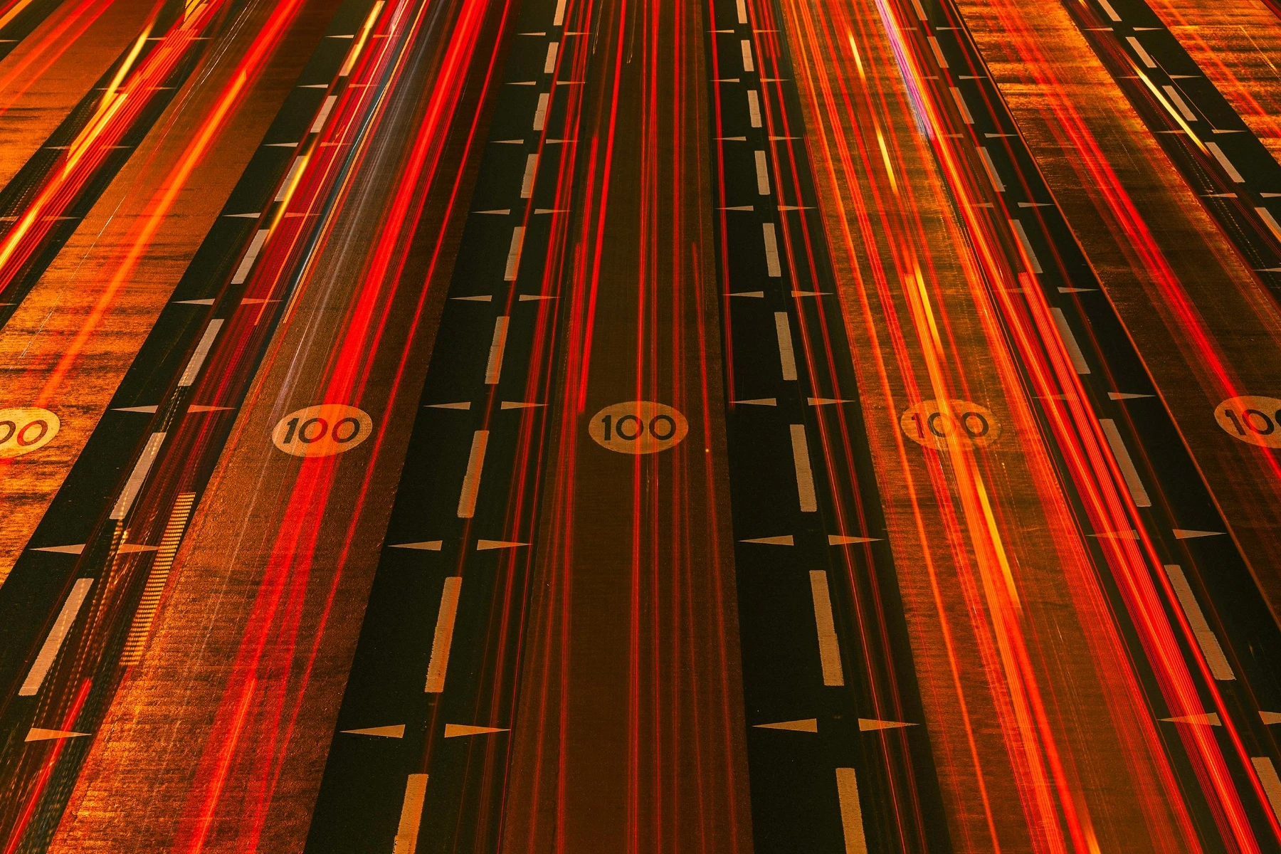Red lights showing fast moving vehicles on a motor way