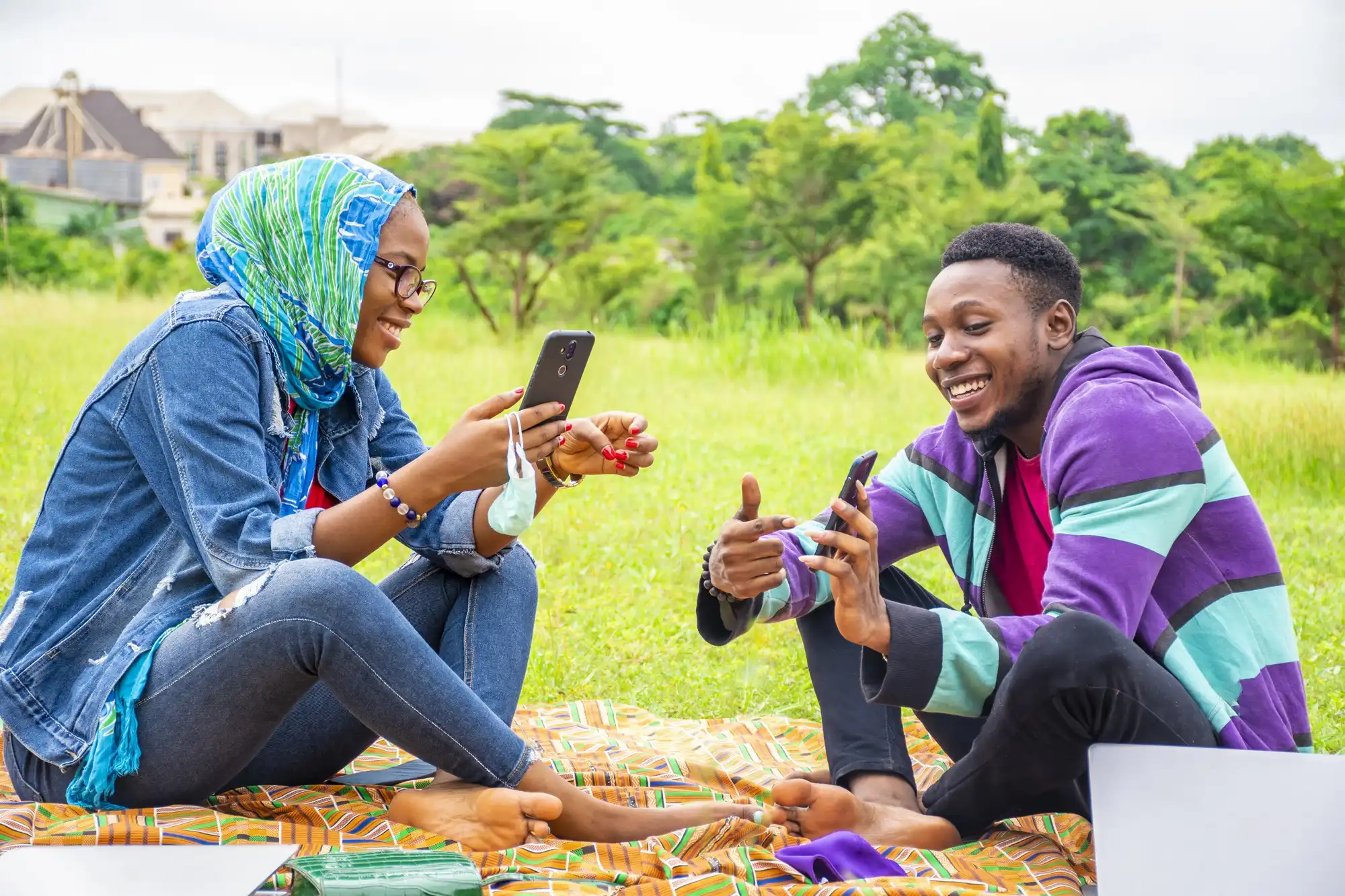 Young TikTok users in Kenya engaging with content as the platform's AI moderation significantly scales up.