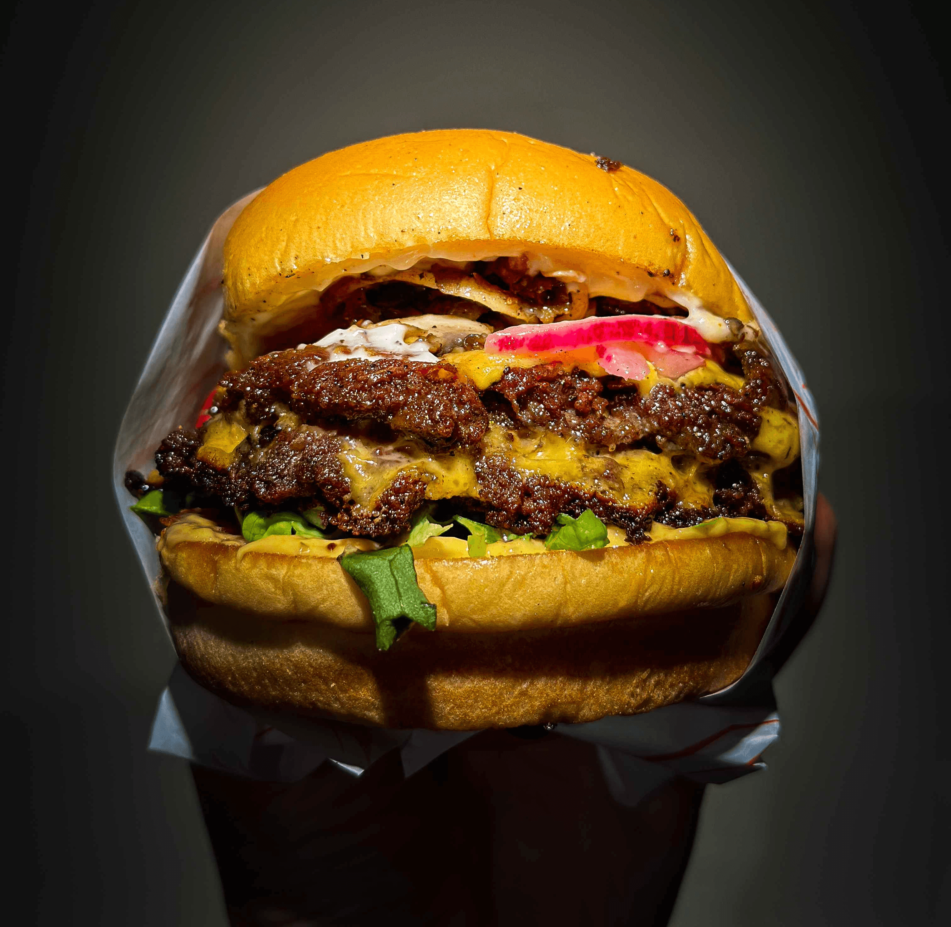 a spotlight image of out off the dome double smash burger