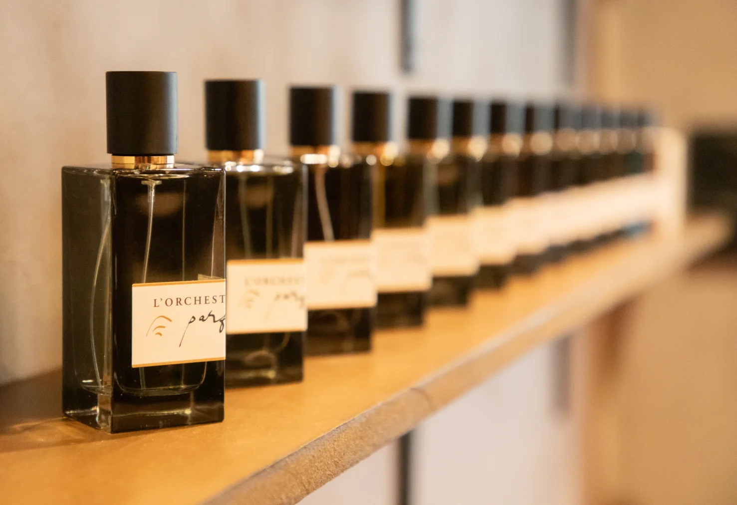 A close-up of a person wearing green-tinted glasses, with a serious expression and smooth skin.