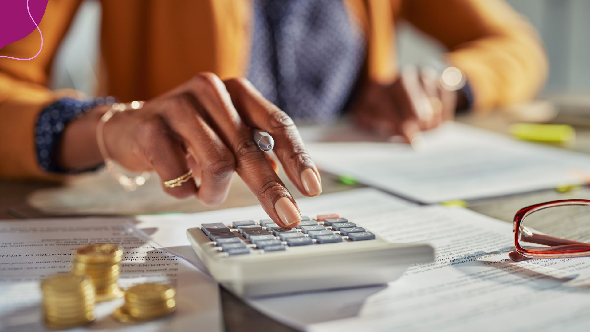 woman's hands using calculator