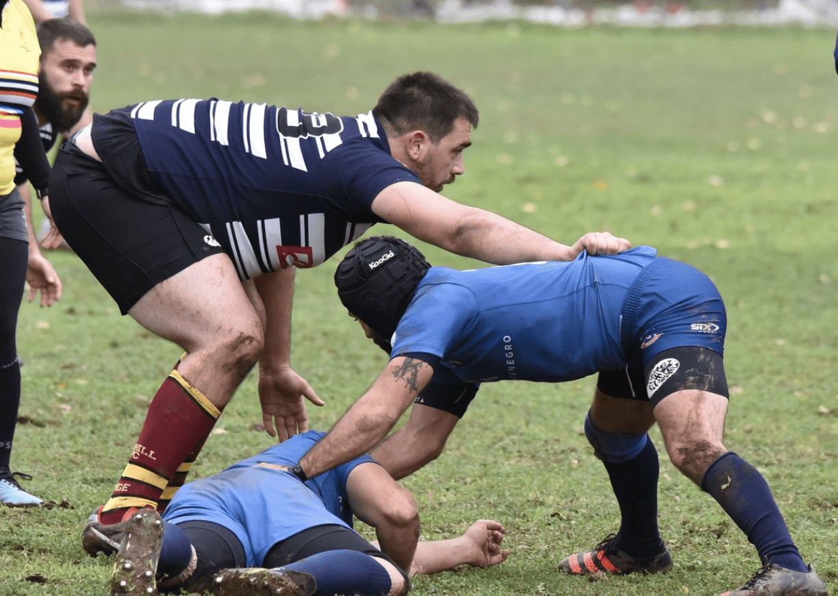 three players in ruck