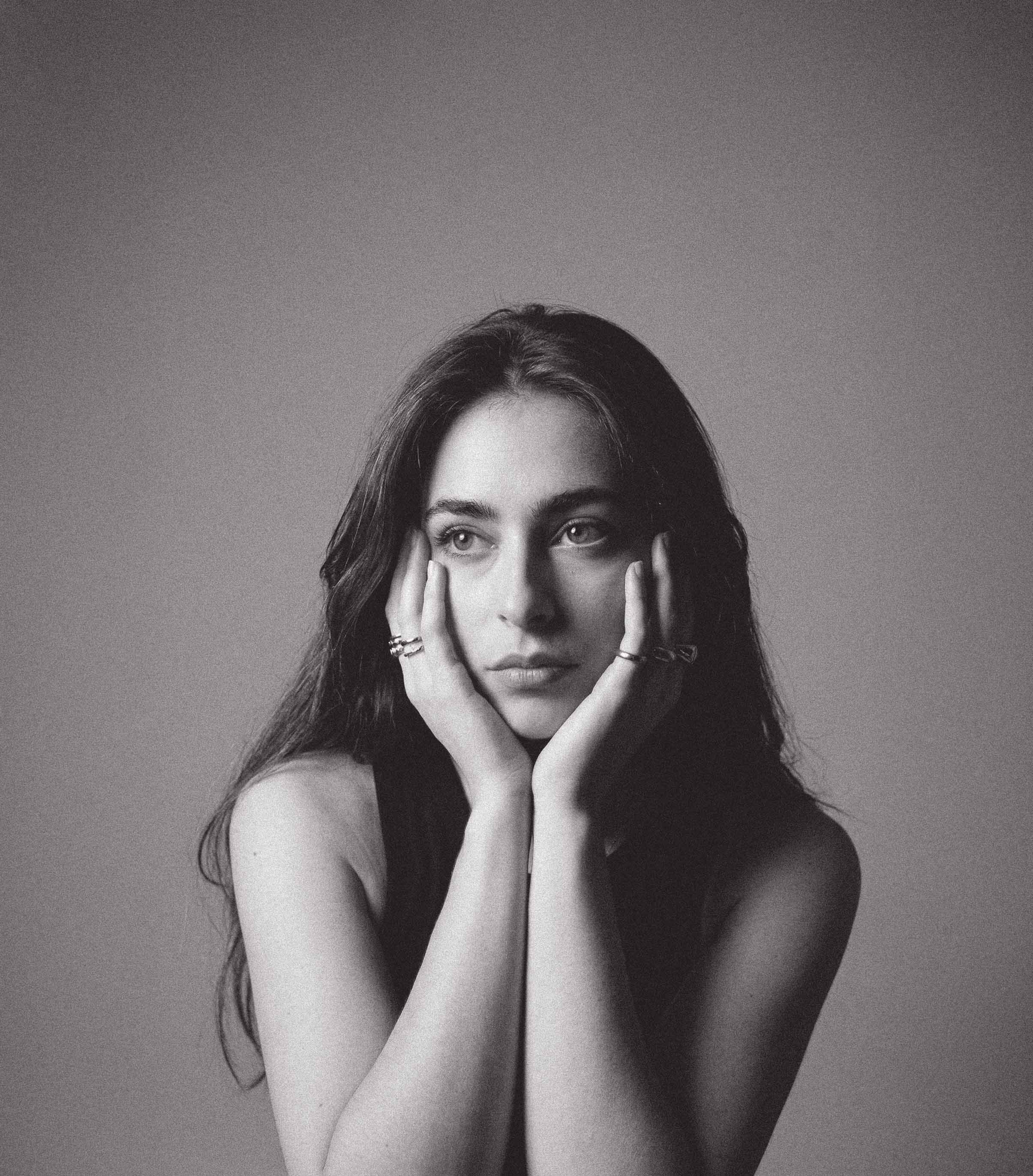 a blurry photo of a person standing in front of a wall