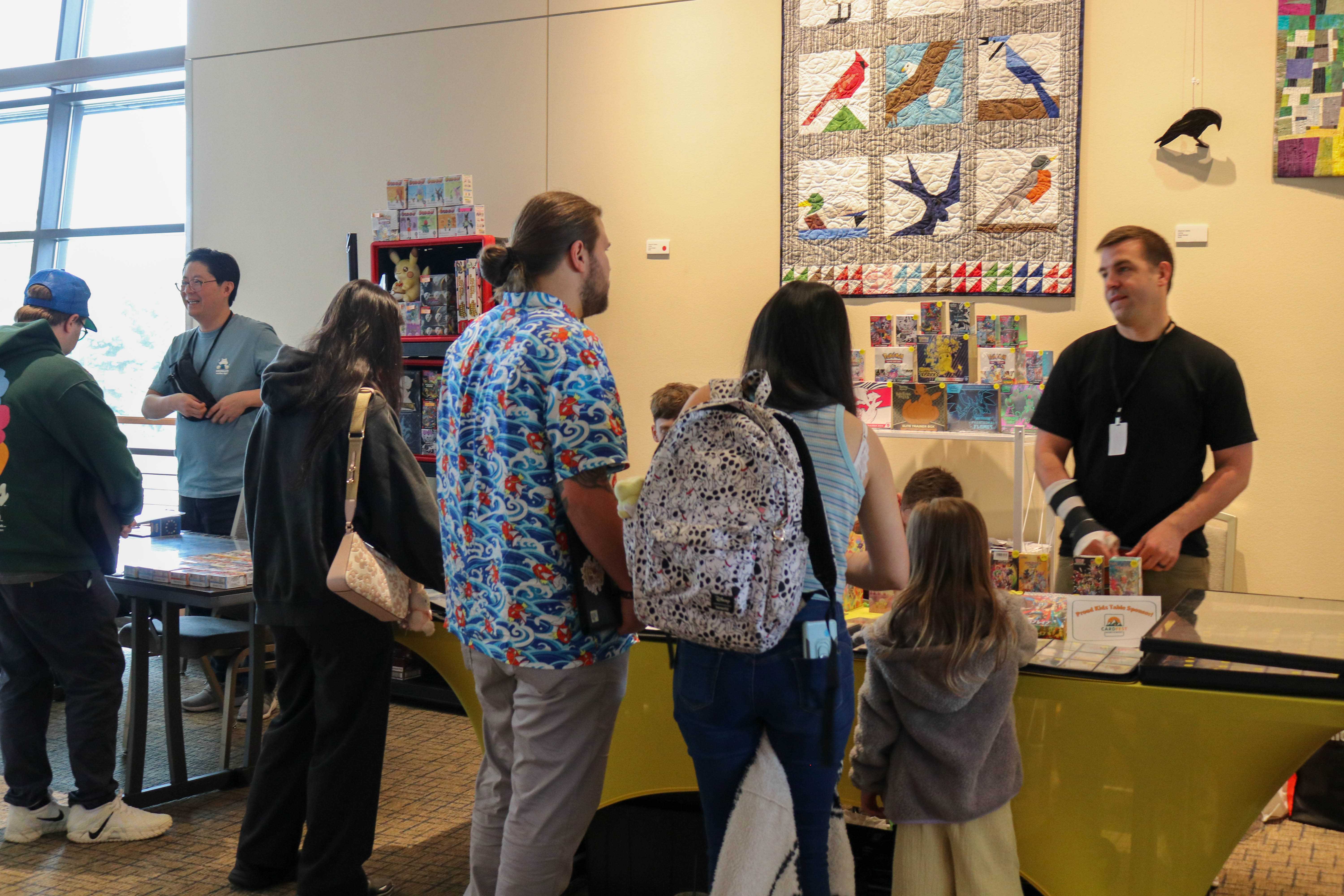 Attendees browsing a vendor table