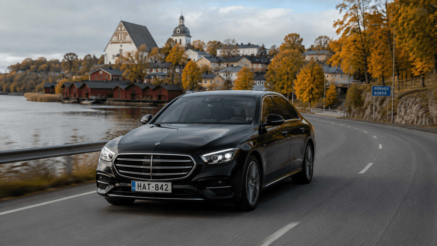 Black Mercedes on a Finnish coastal road during a private long-distance transfer