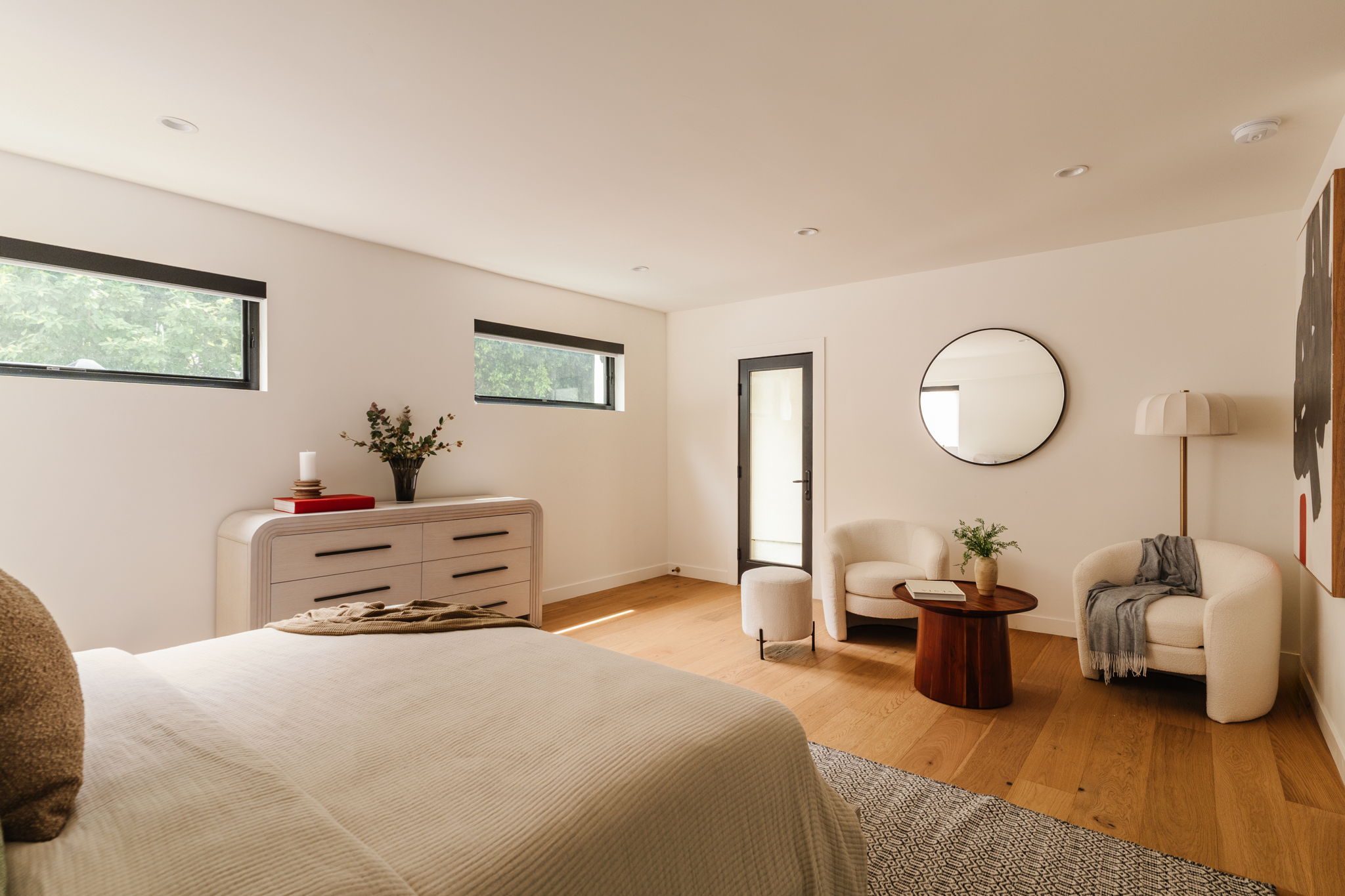 Bright bedroom with colorful bedspread and wall art
