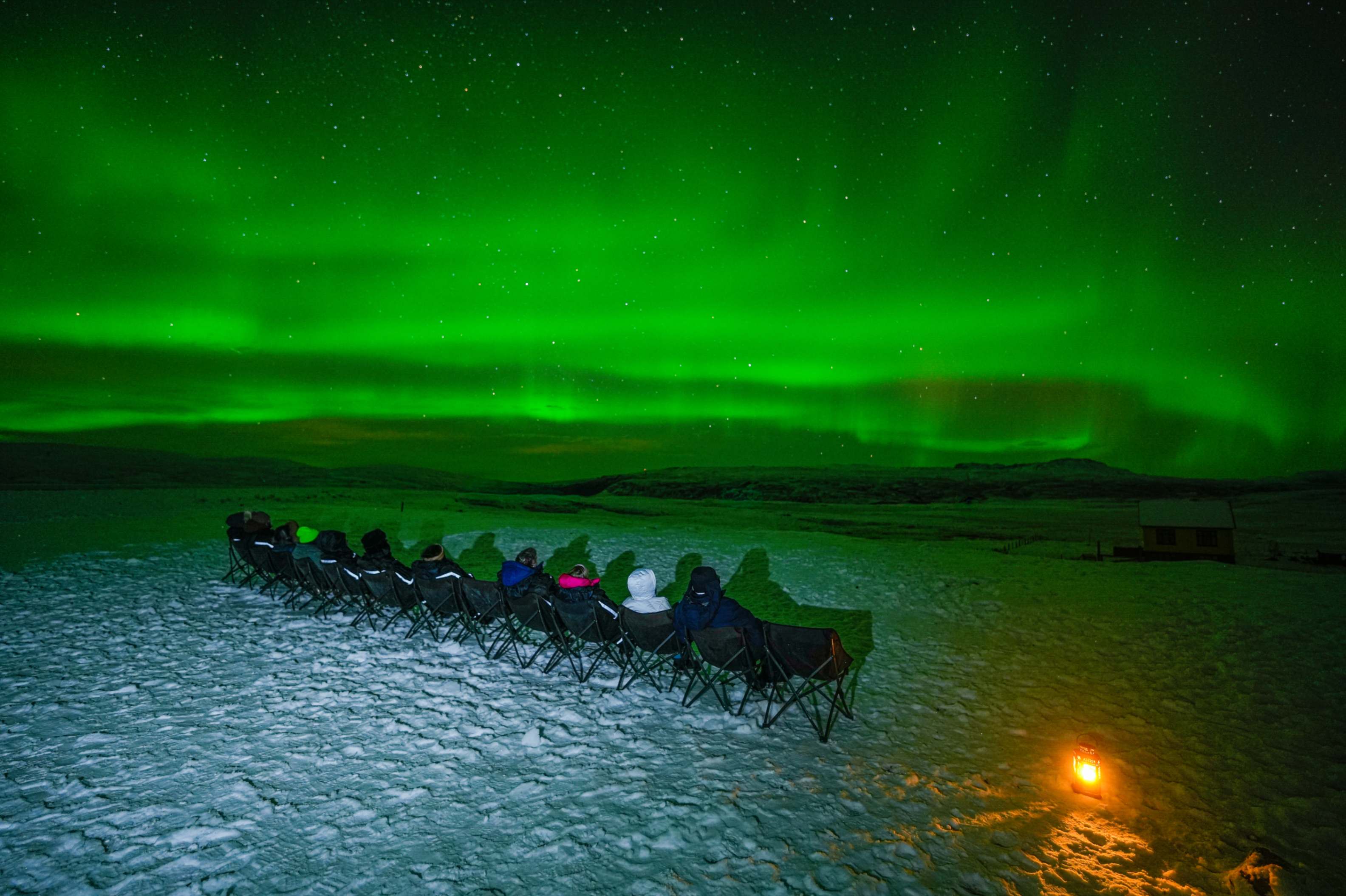 Northern Lights tour photography from Aurora Experts in Iceland, featuring guests beneath the aurora, winter landscapes, and vivid skies over remote Icelandic locations.
