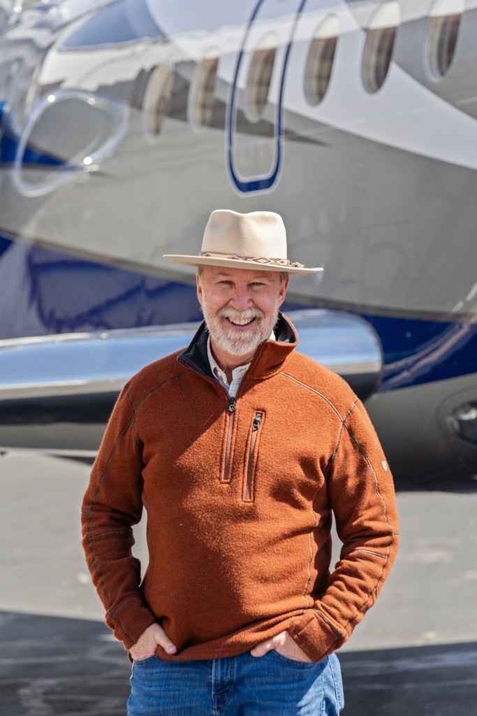 person sitting in a chair in front of a man