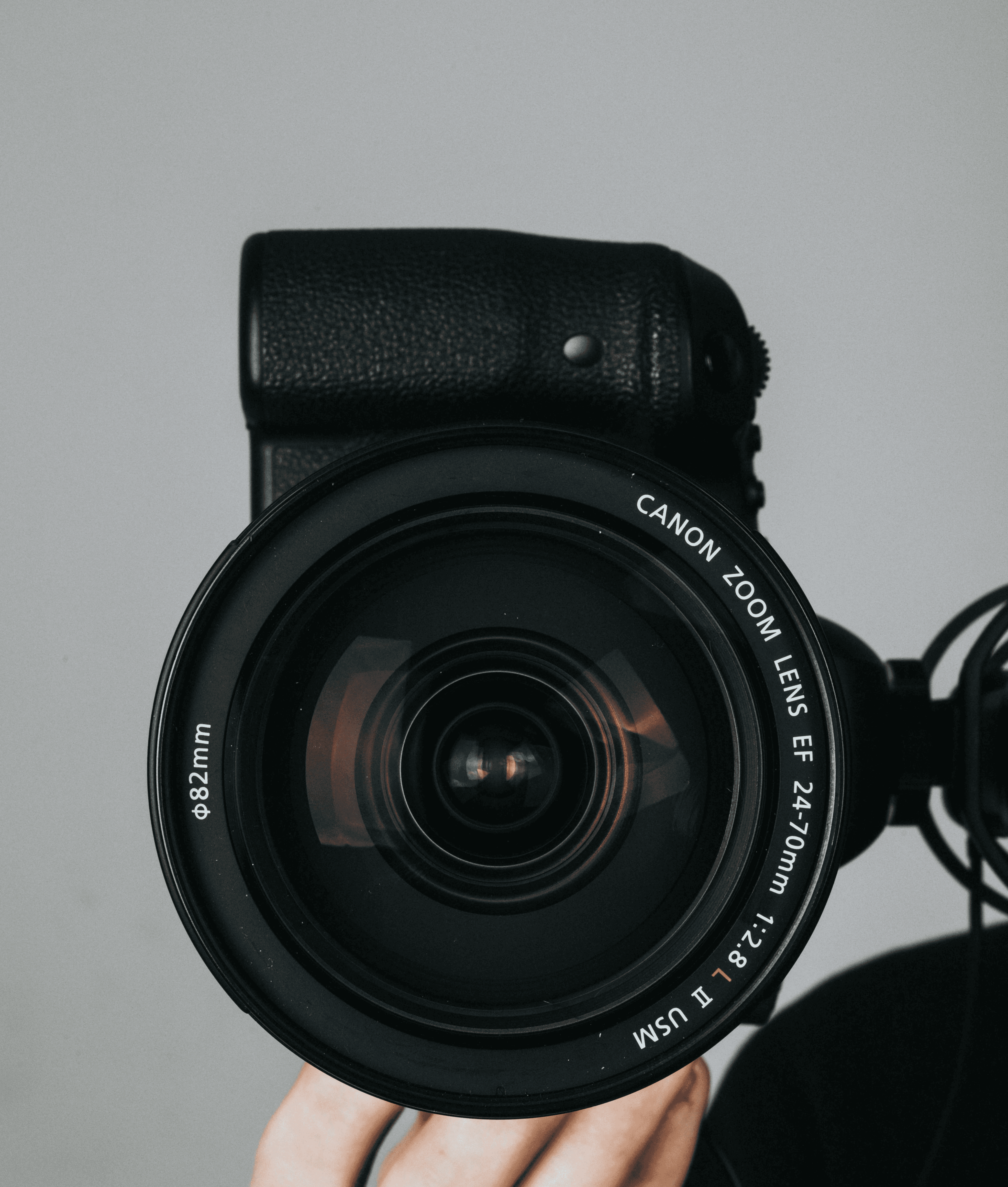 black nikon dslr camera on persons hand