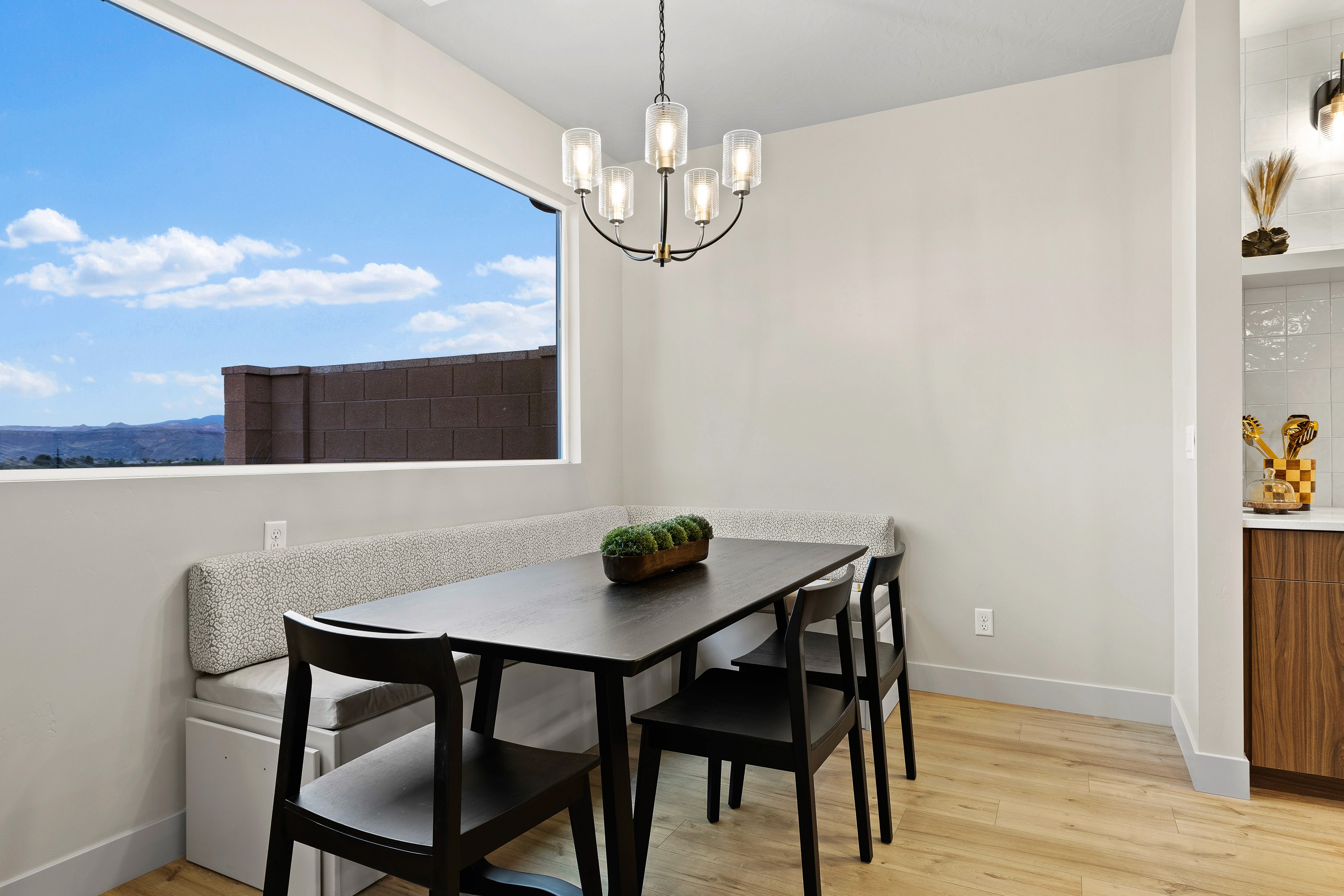 Dining room inside The Painted Horizon twin home in Hurricane, Utah connecting seamlessly with the kitchen and great room.