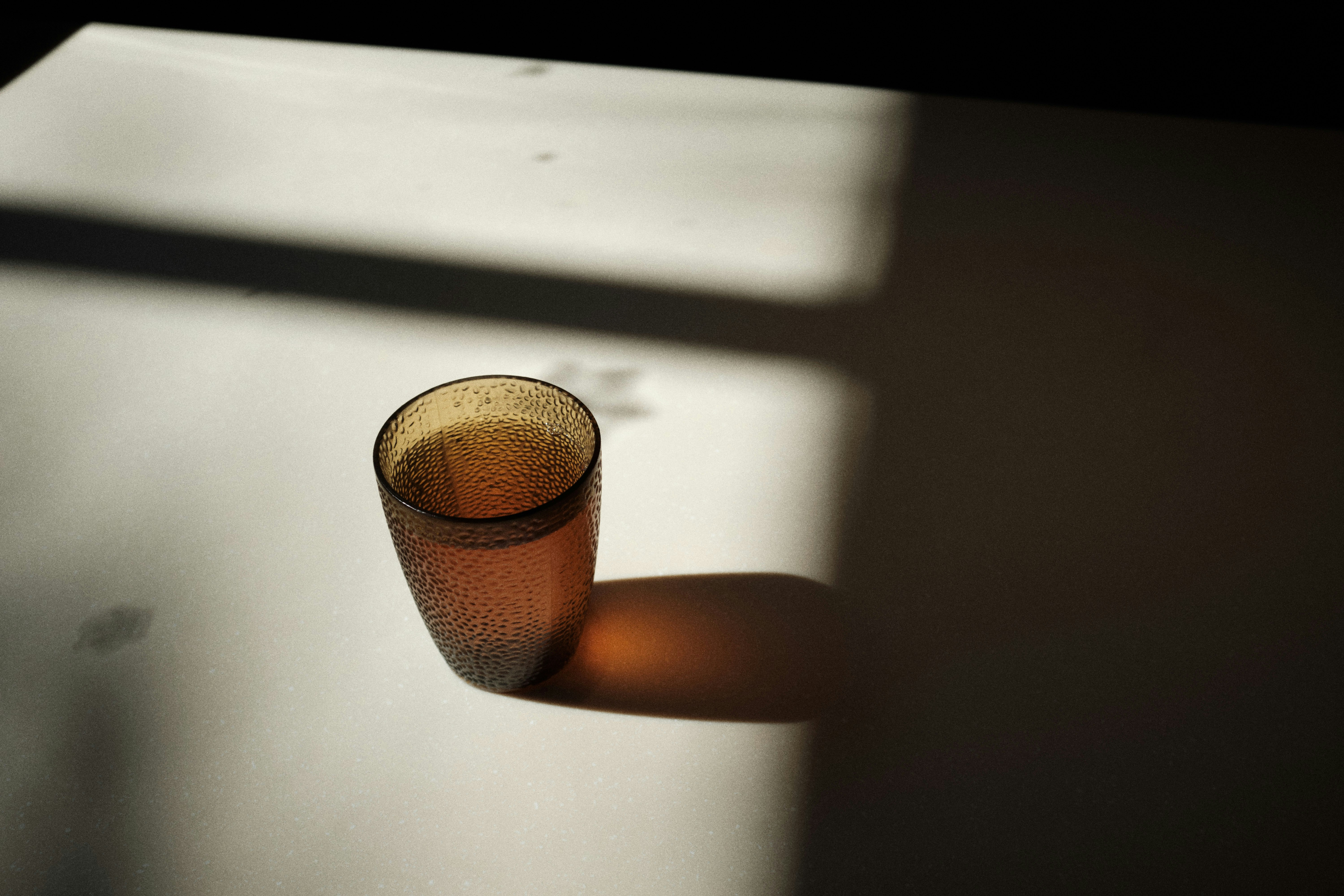 a small glass sitting on top of a table