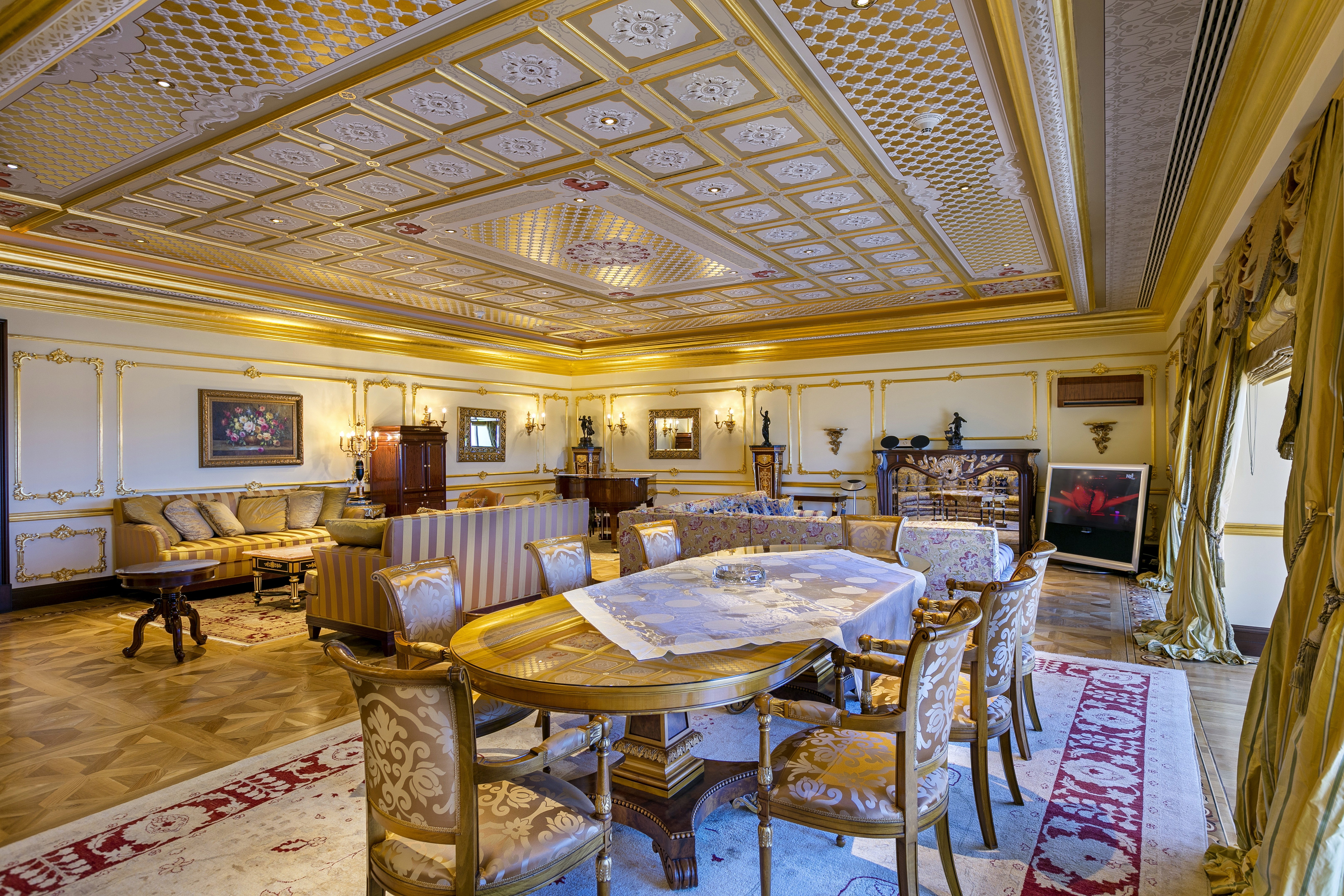 Grand living area showcasing refined design, rich textures, and an atmosphere of royal elegance.