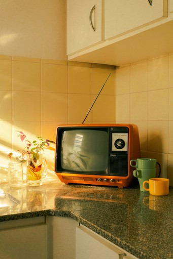 brown crt tv on brown wooden table