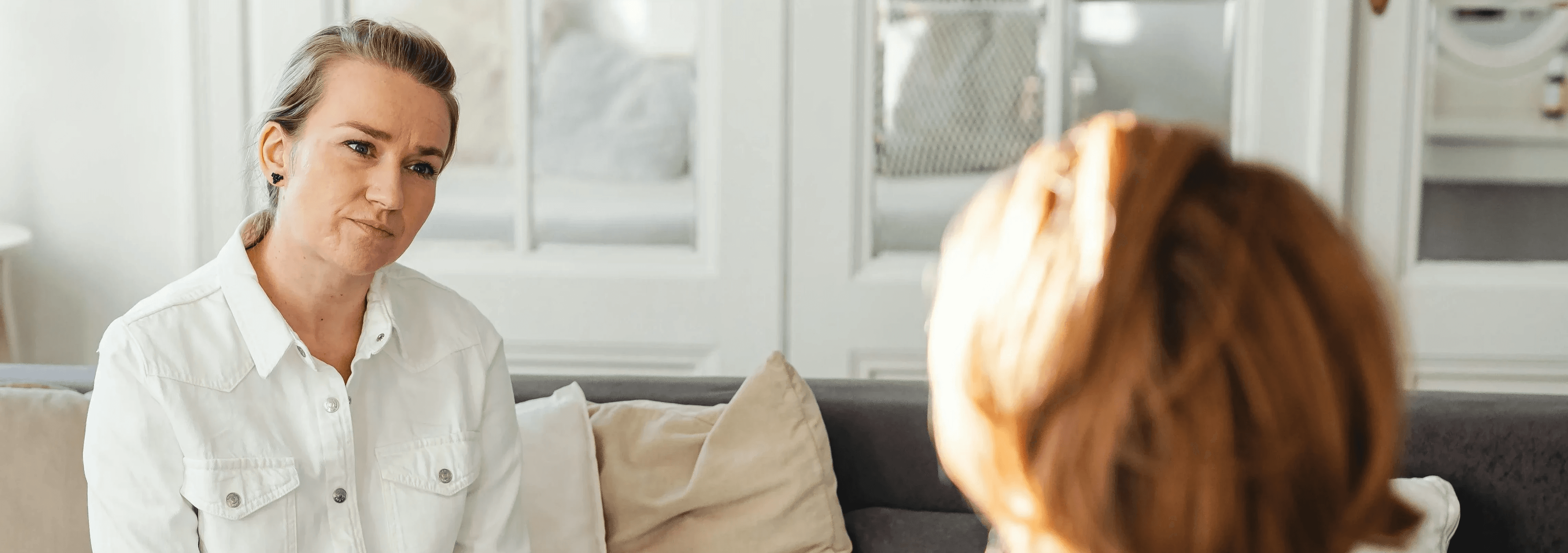 Career coach and client in a consultation session discussing coaching options