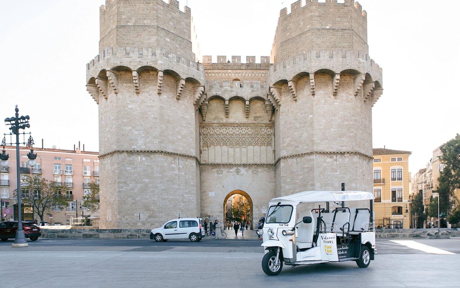 Tuk Tuk in front of Torres de Serranos, Valencia.