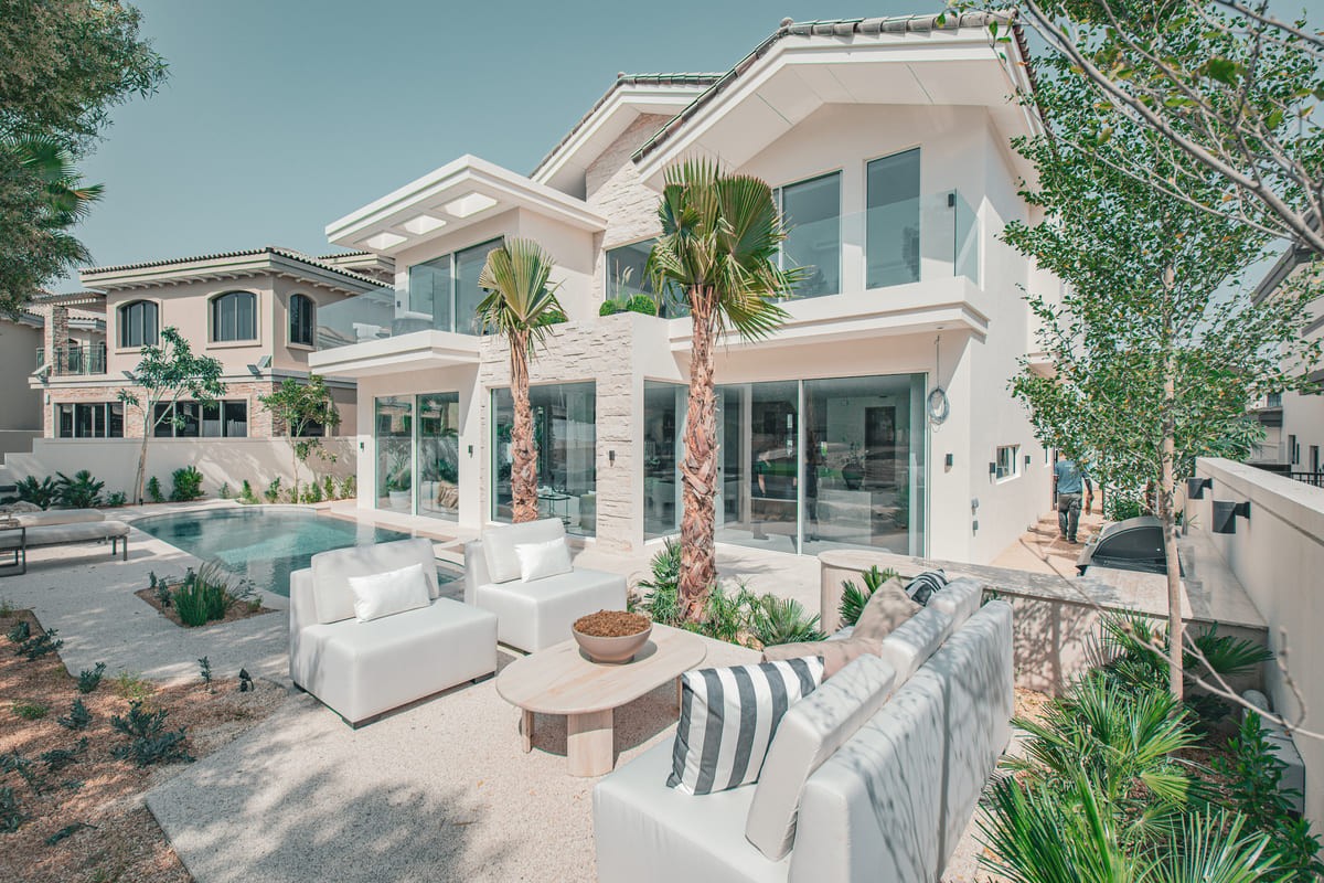 Image of a large villa with big glass windows