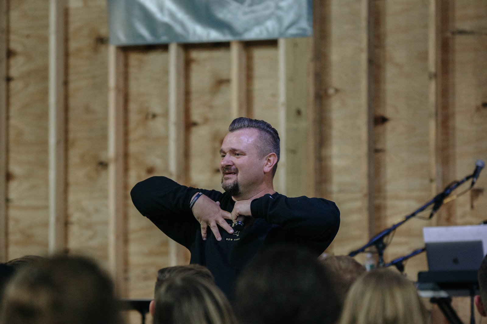 A pastor speaking to a gathered congregation