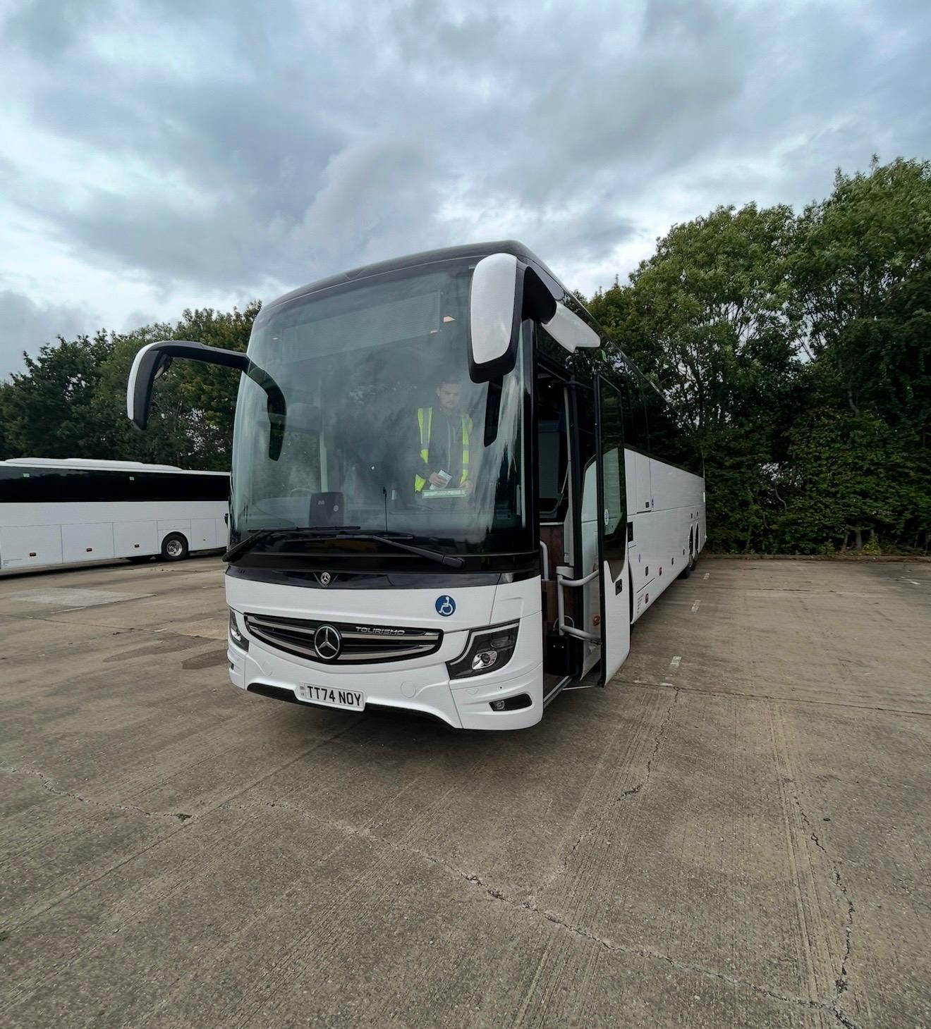 Luxury coach and minibus fleet used for city tours and private transfers, showcasing premium travel services and modern design in urban and scenic environments