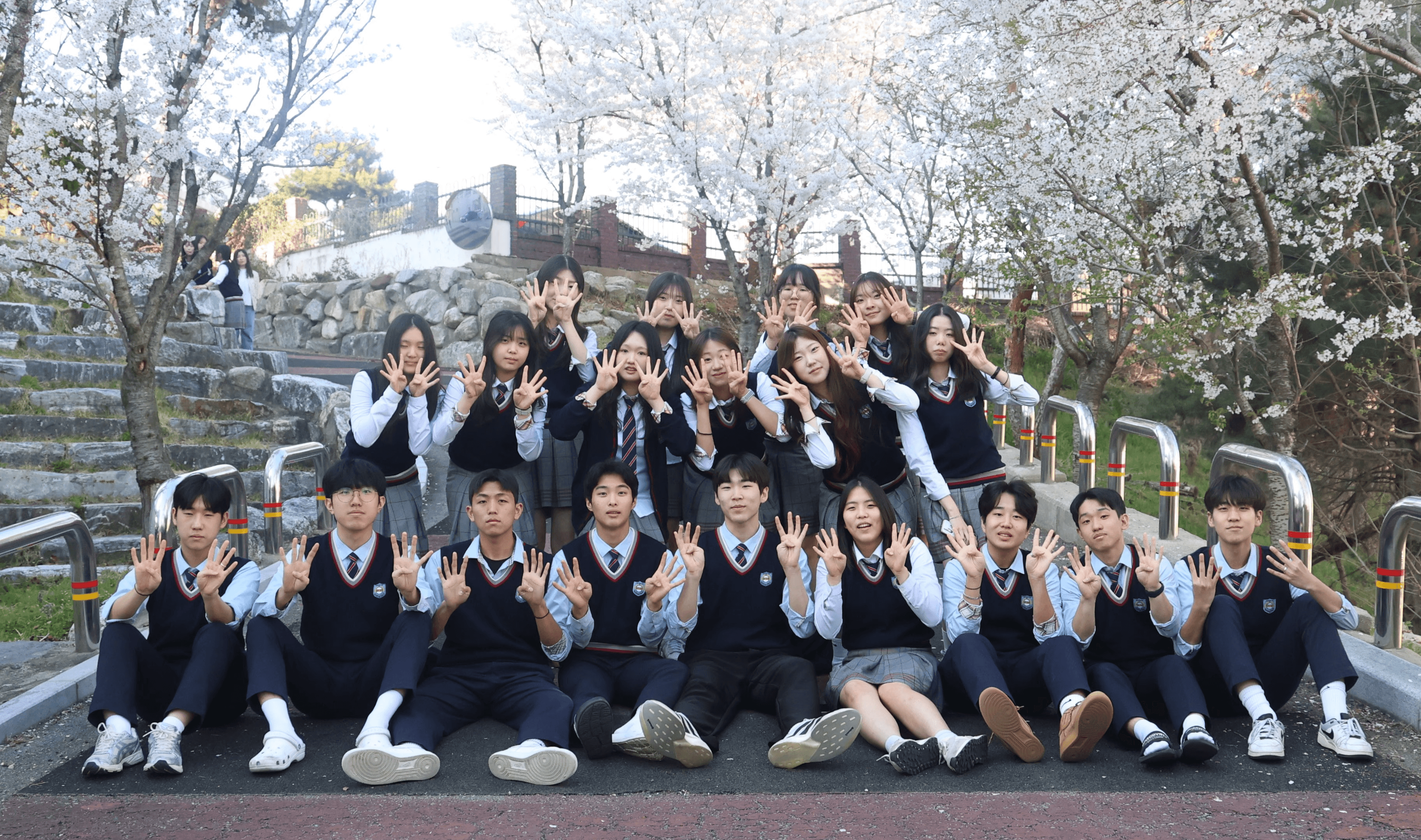 Palm trees reach towards a vibrant, blue sky.