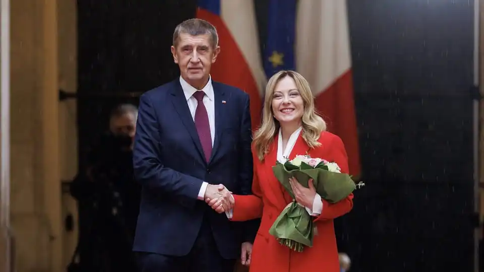 Two political leaders shaking hands at an official event