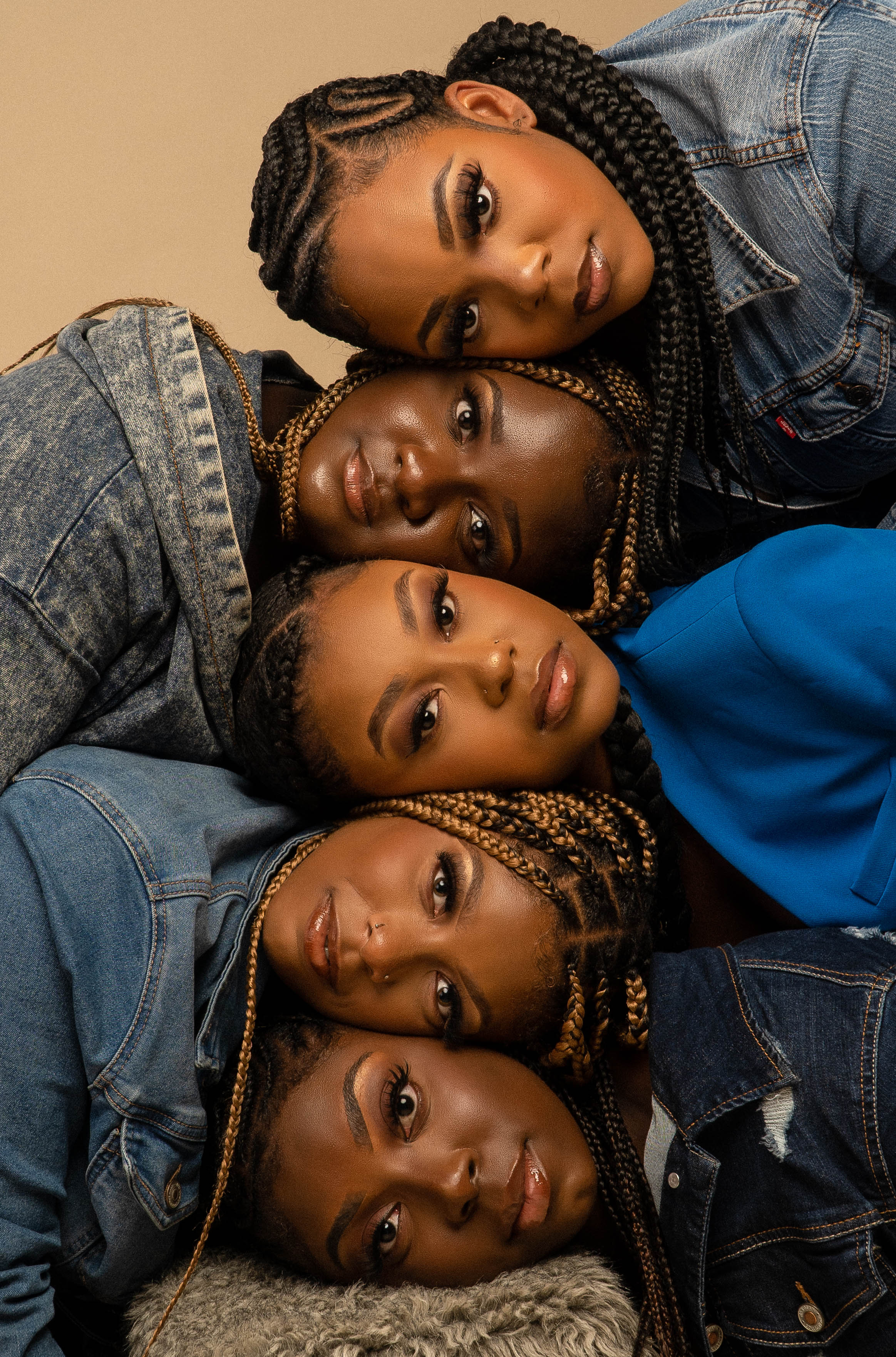 Five women in the Viva Luxe Roots campaign against a natural tan background