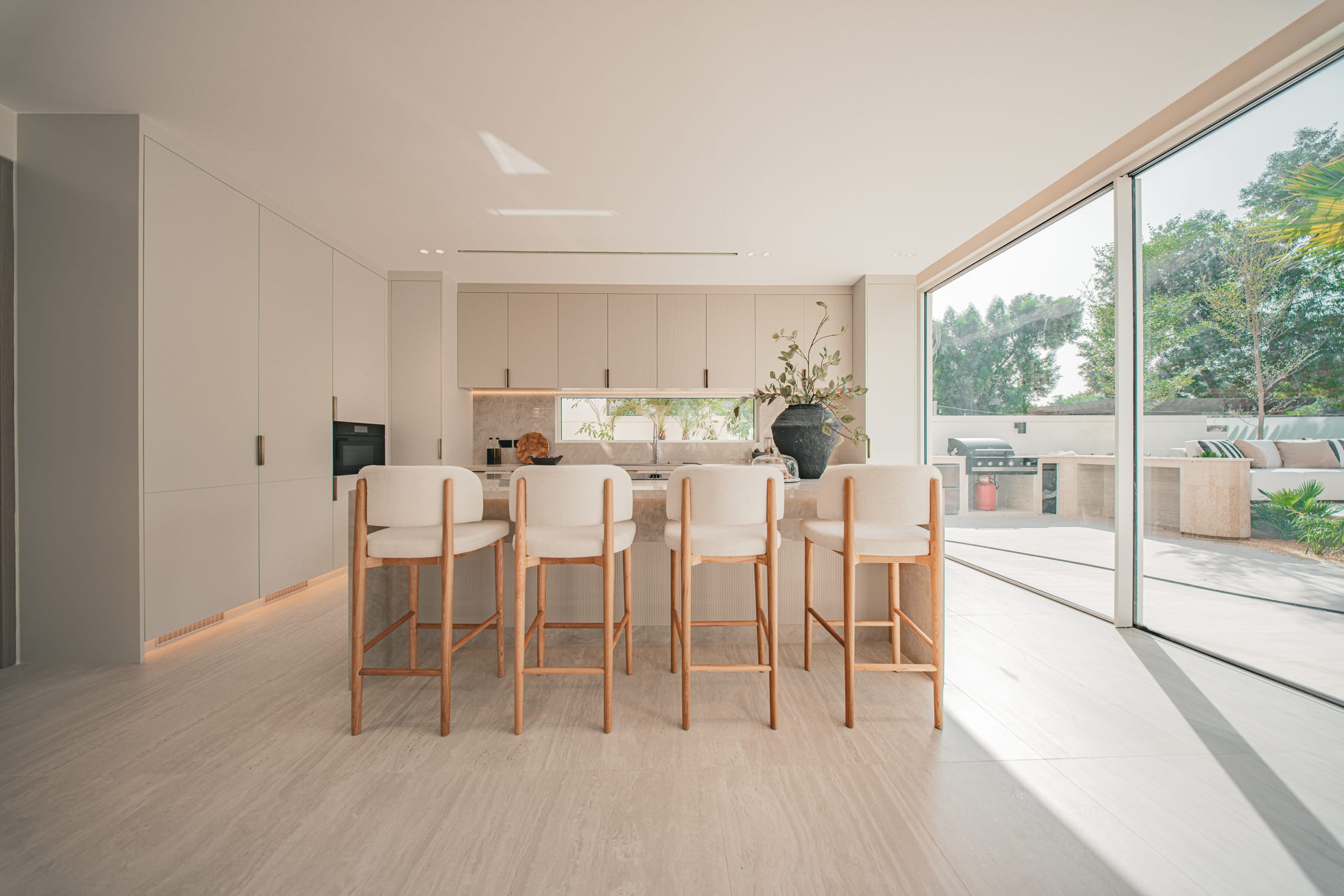 Image of a large villa with big glass windows