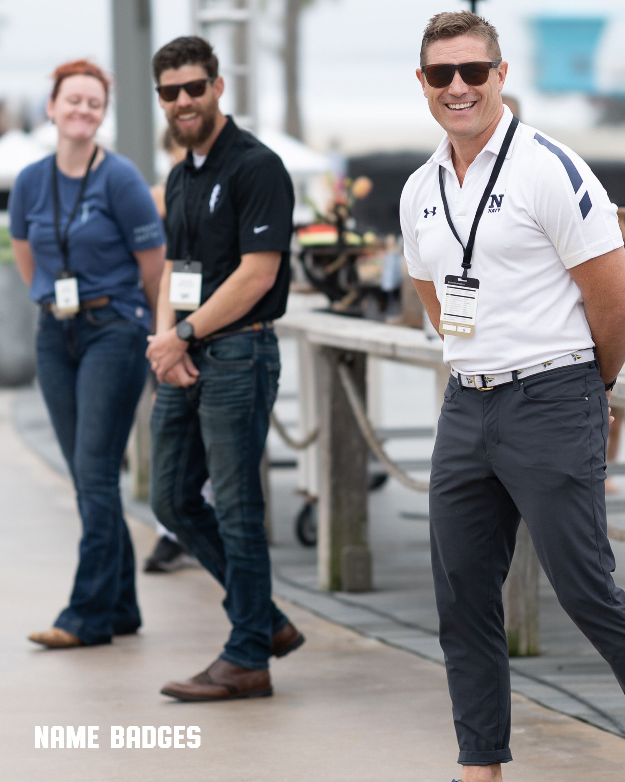 Men with name badge lanyards for founders weekend event