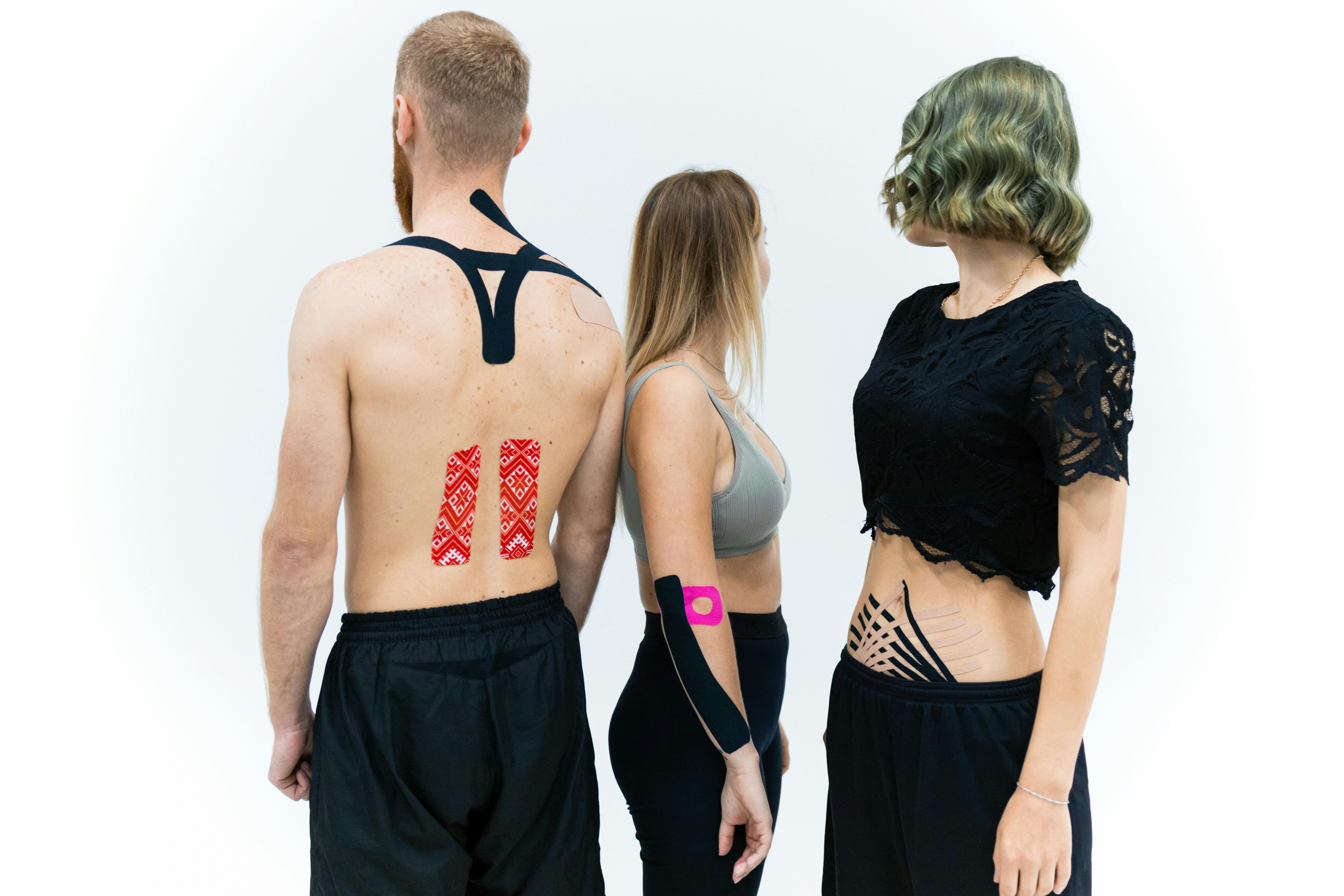 Photo by Maksim Goncharenok: https://www.pexels.com/photo/people-with-elastic-therapeutic-tape-6094333/