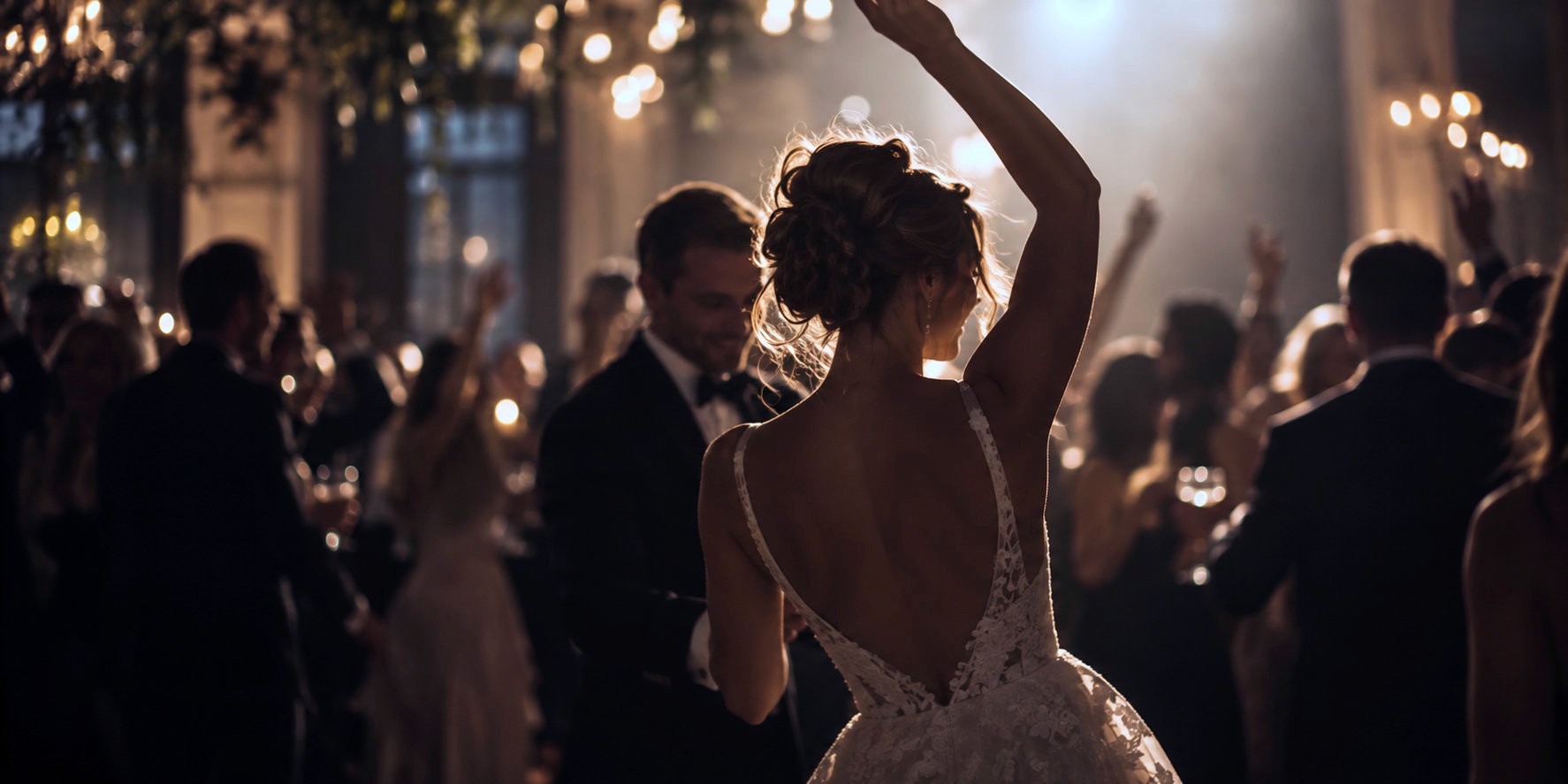 Bride dancing with guests at an evening wedding reception