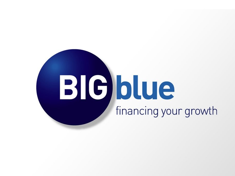 Rustic cabin in a golden field at sunset