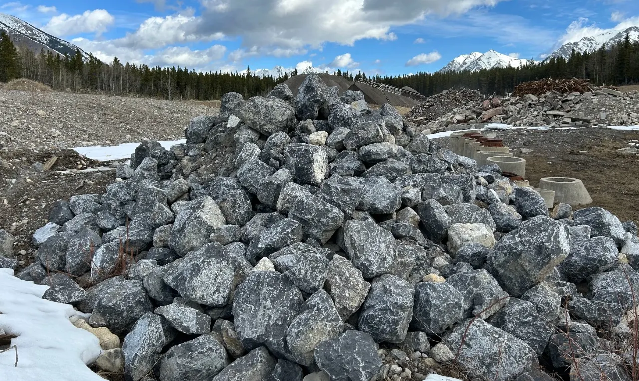 Telescoping stacker conveyor building a crushed aggregate stockpile at a Storage Yard in Kananaskis, Alberta