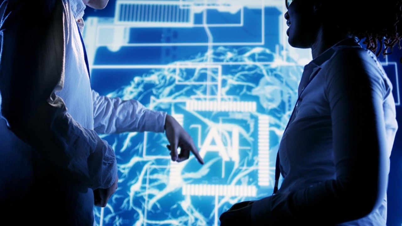 man sitting beside woman looking at a contract on DocuSign