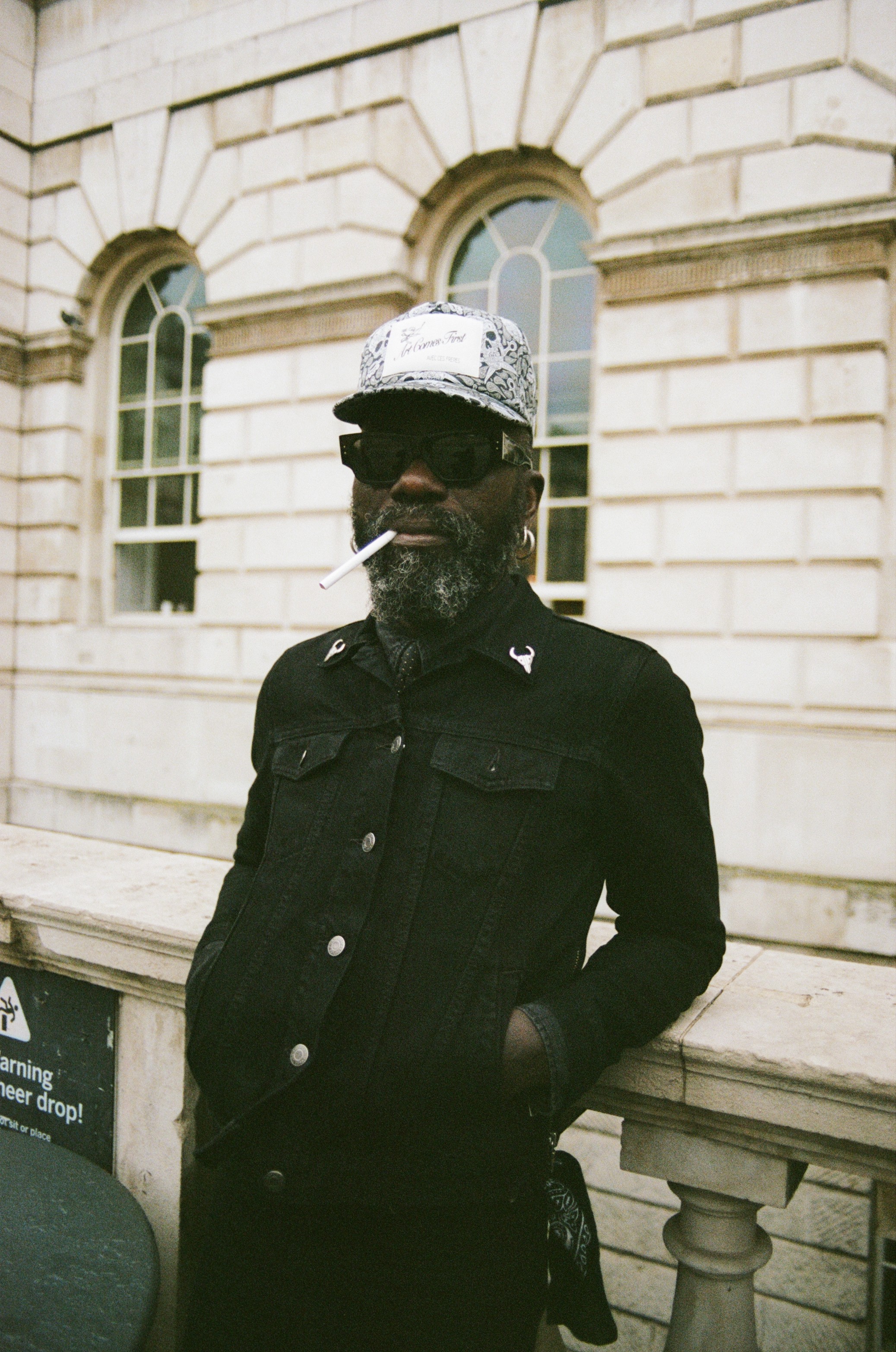 Woman with red hair covering mouth with hair