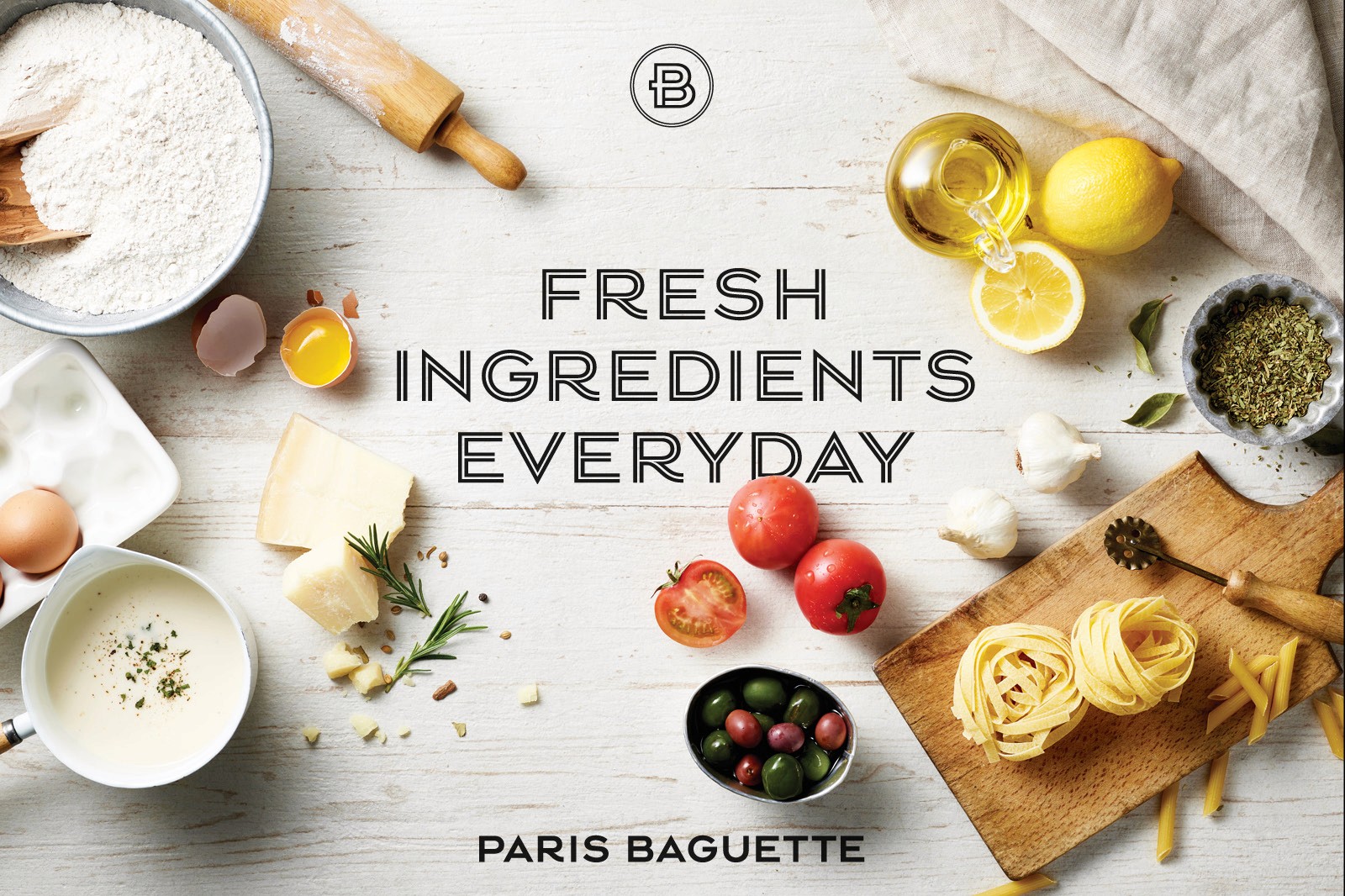 A flat lay of fresh ingredients including fruits, herbs, and spices, with the text "Fresh Ingredients Everyday."