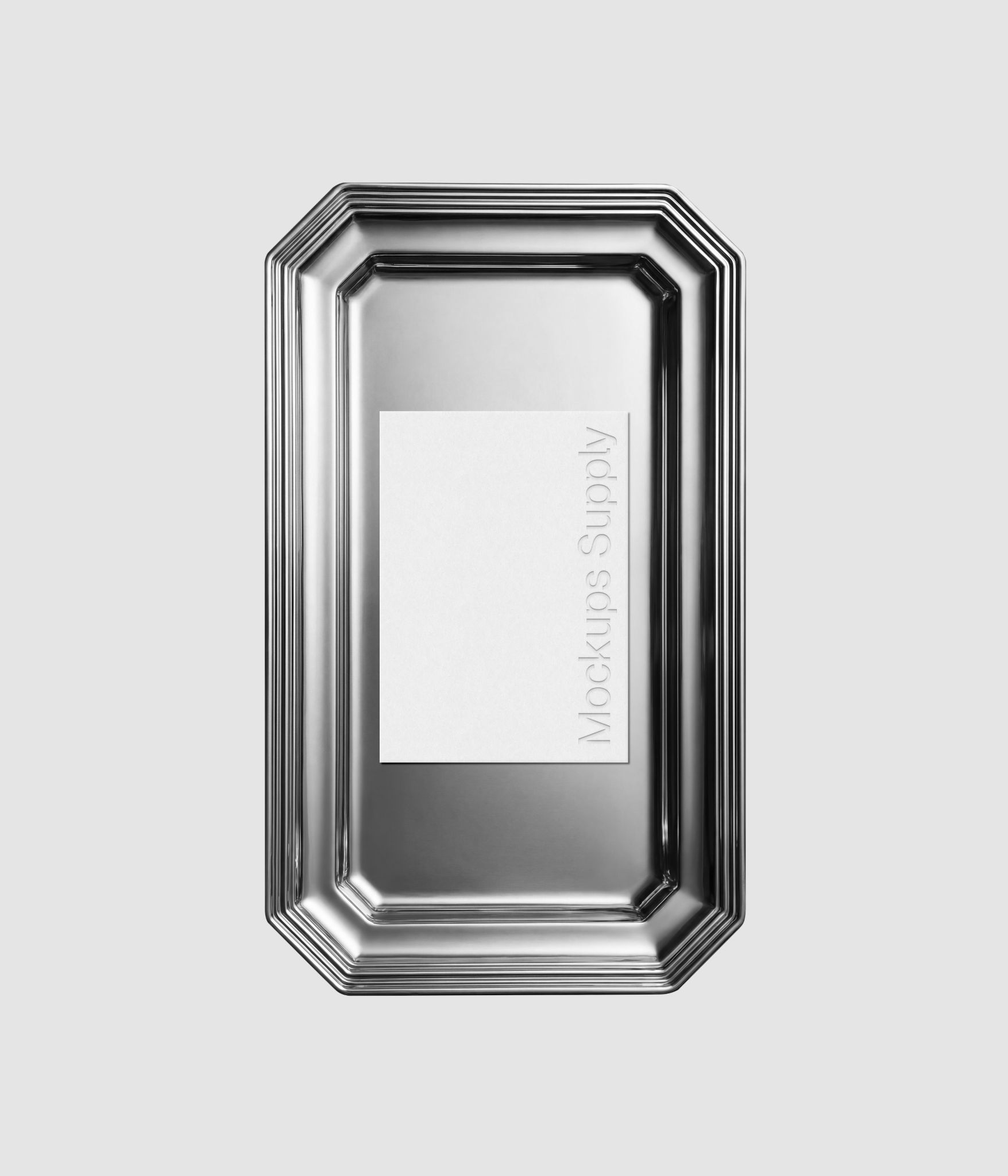 Paper mockup on vintage silver plate with editable design for logo showcase and identity presentation download on Mockups Supply