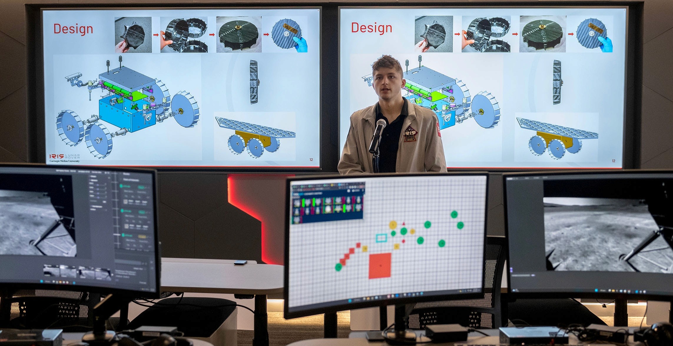 Carnegie mellon university student speaking in front on monitors showing vcom