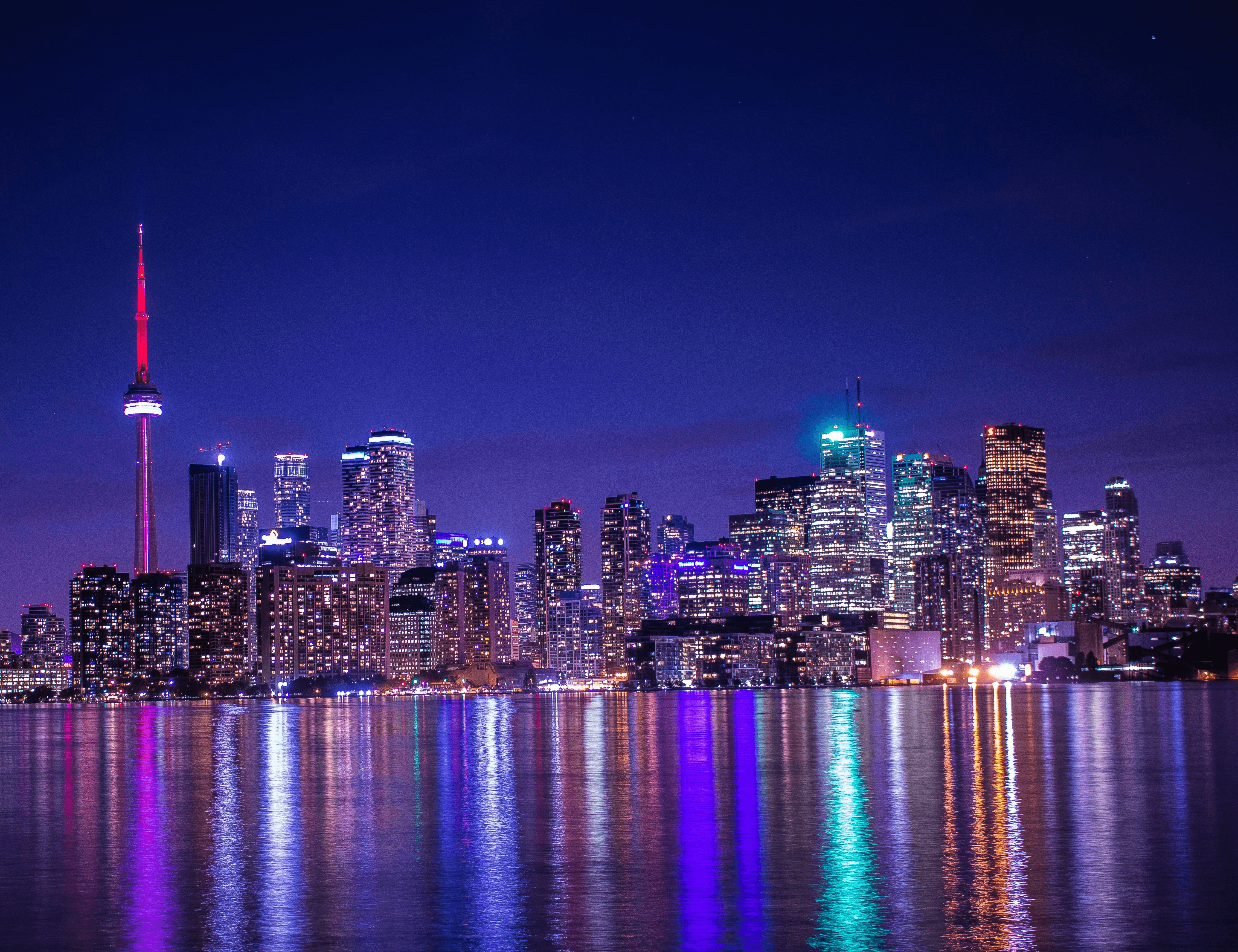 Night view of downtown Ontario city skyline with lights and buildings